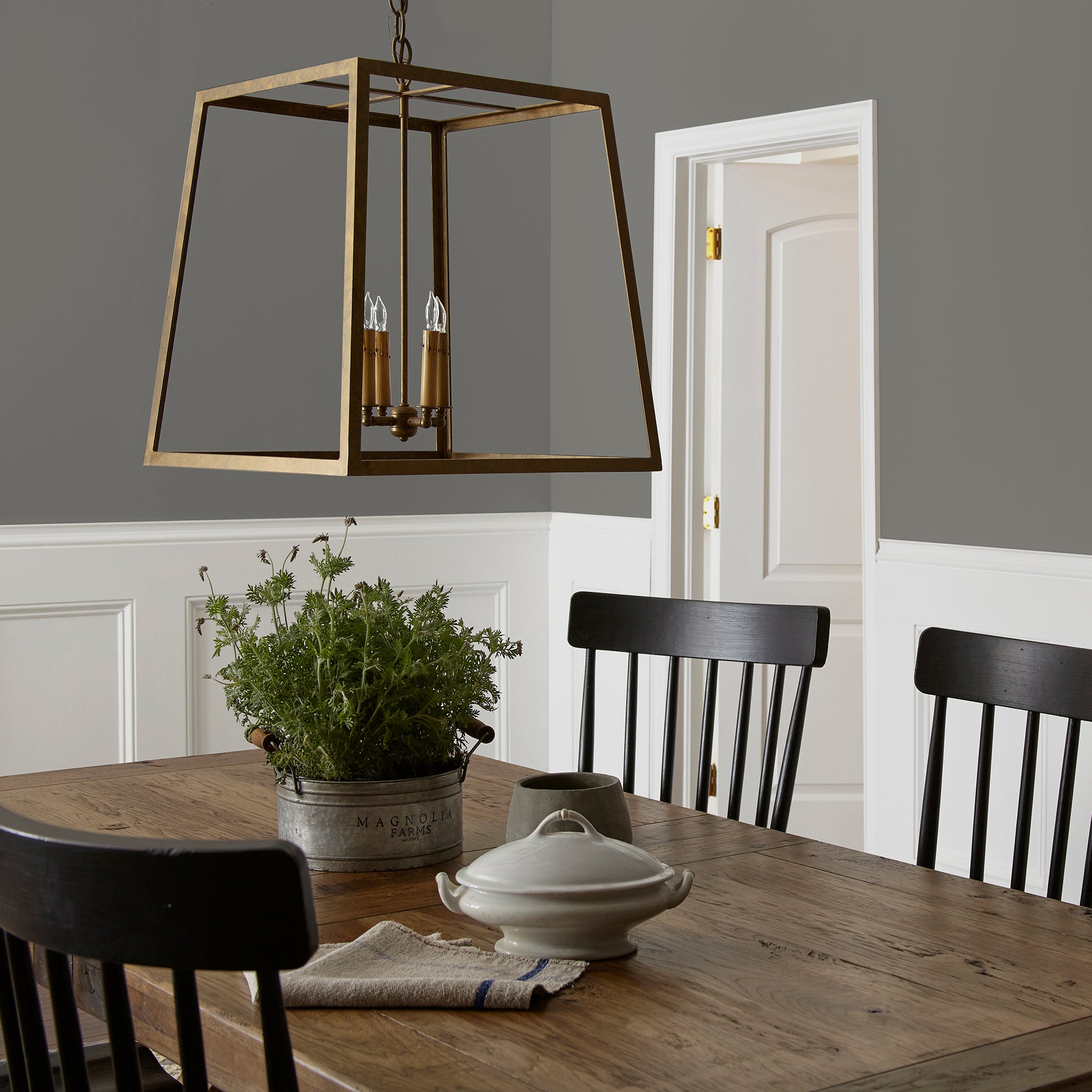 dark grey with brown undertone paint named salvaged shown painted on dining room wall