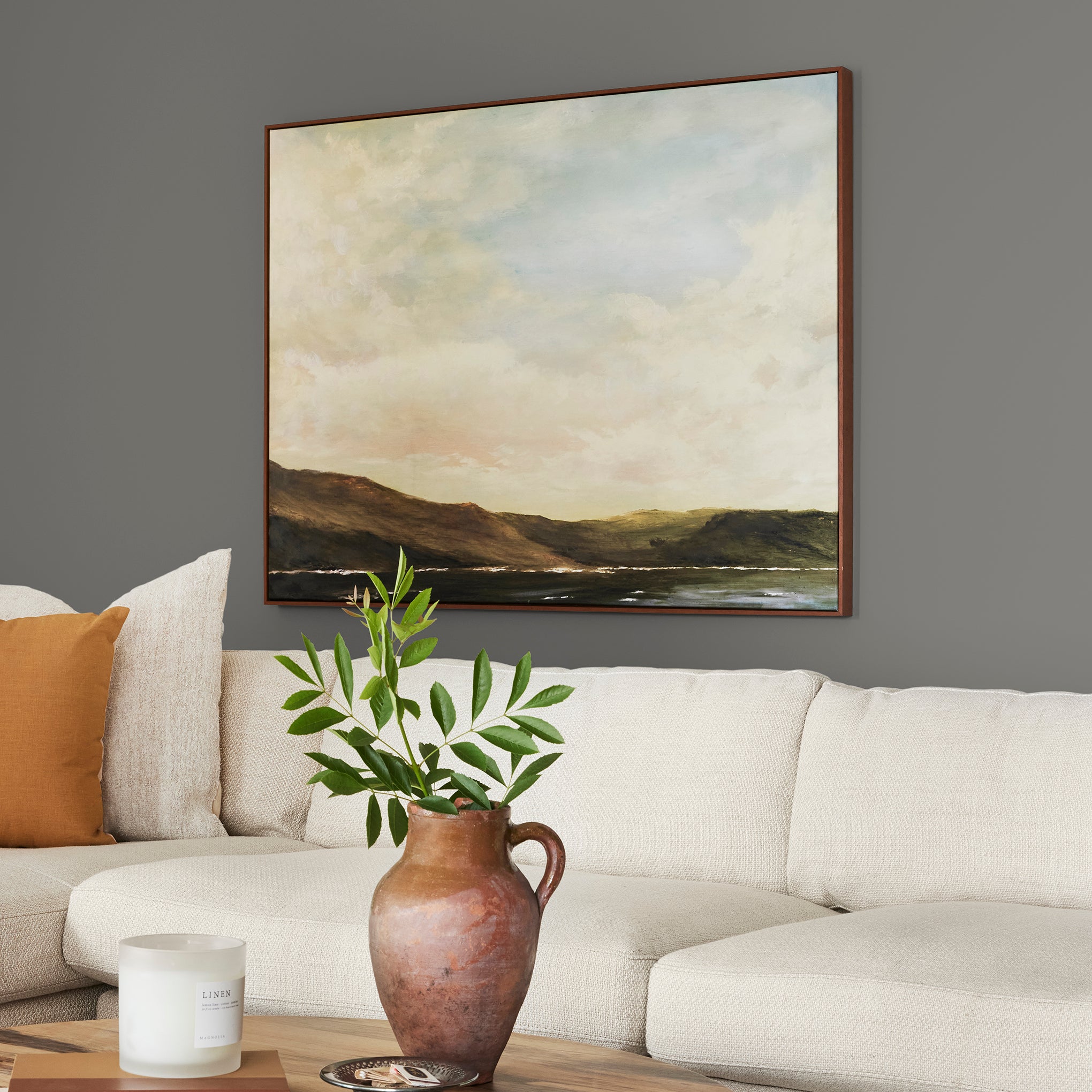dark grey with brown undertone paint named salvaged shown painted on living room wall