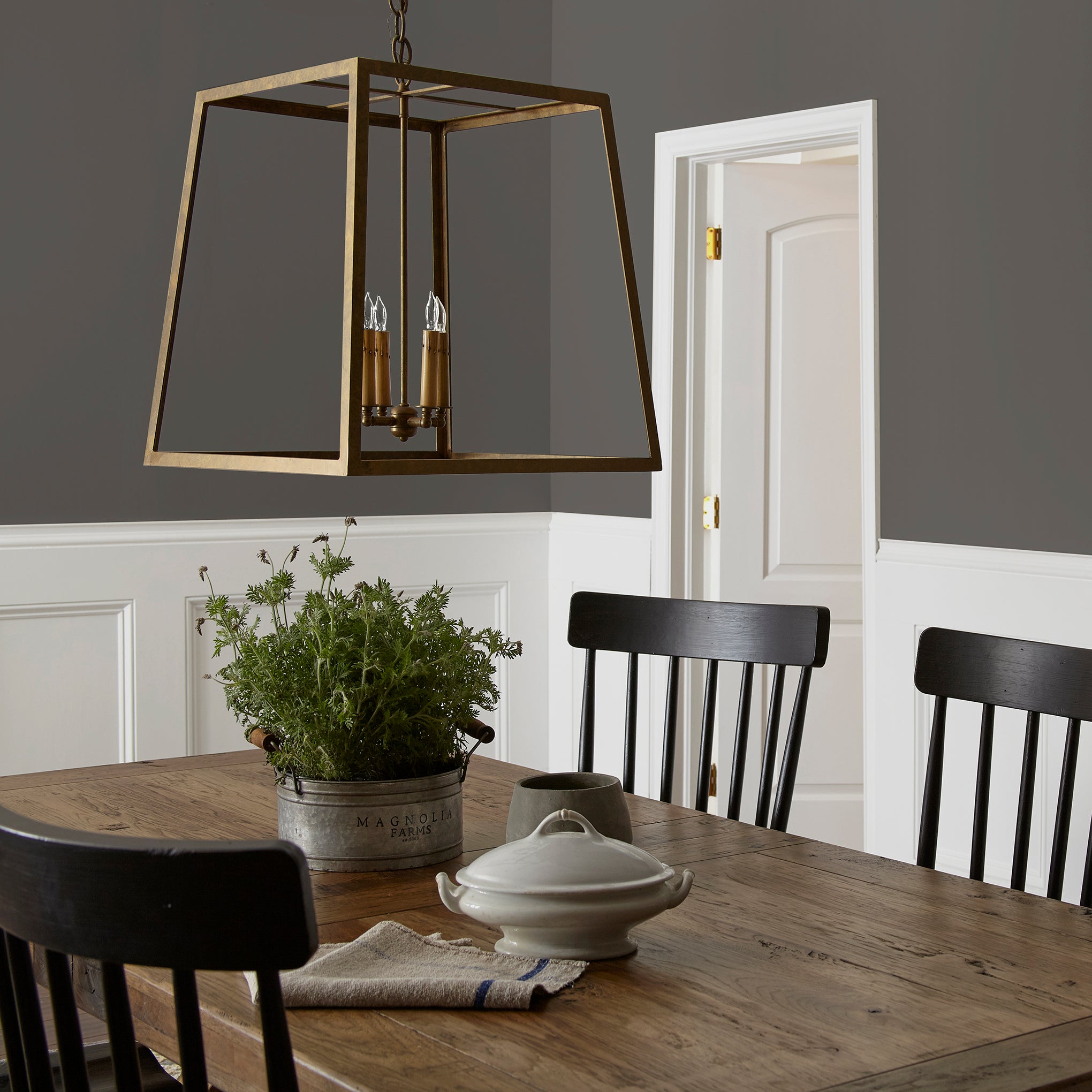 Deep brown with hazel and cocoa notes interior paint named repurpose shown painted on dining room wall