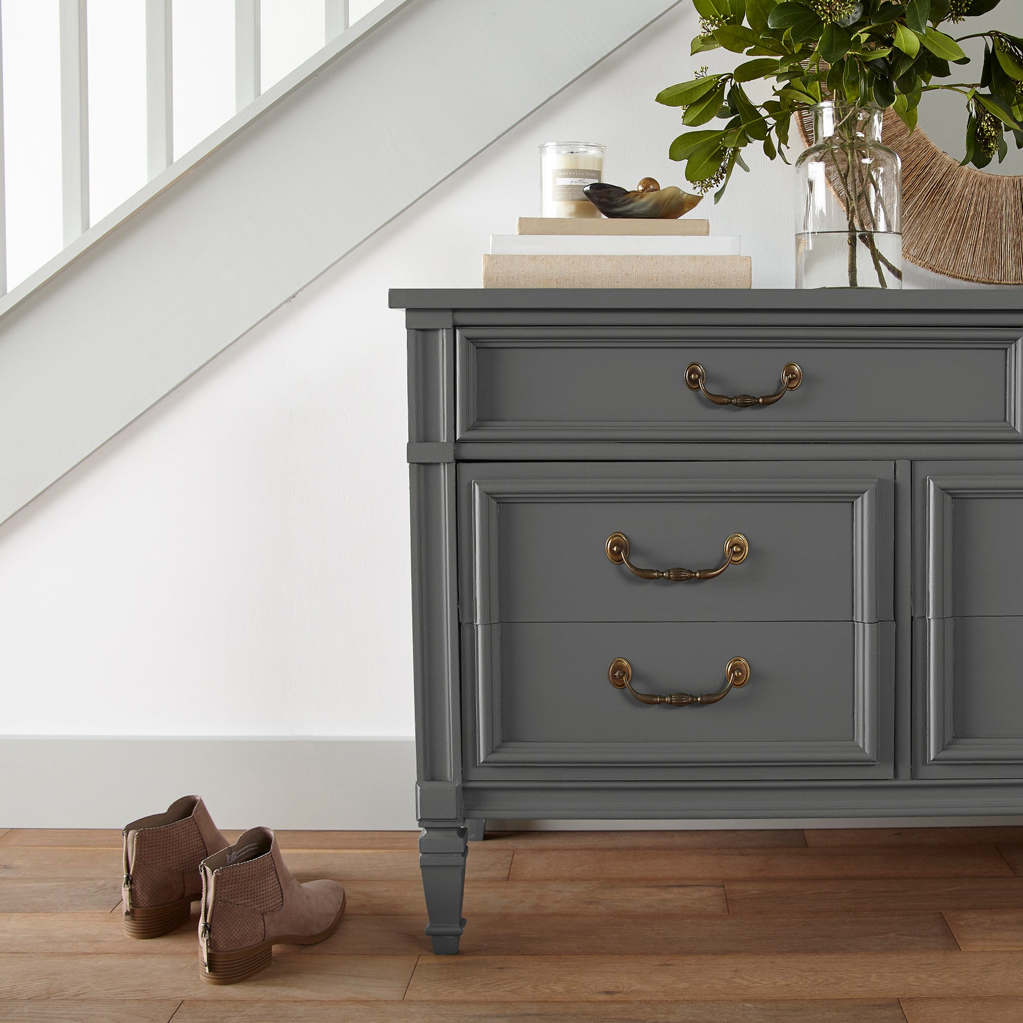 Almost black with green undertones door and cabinet paint named prairie smoke shown painted on entryway cabinet