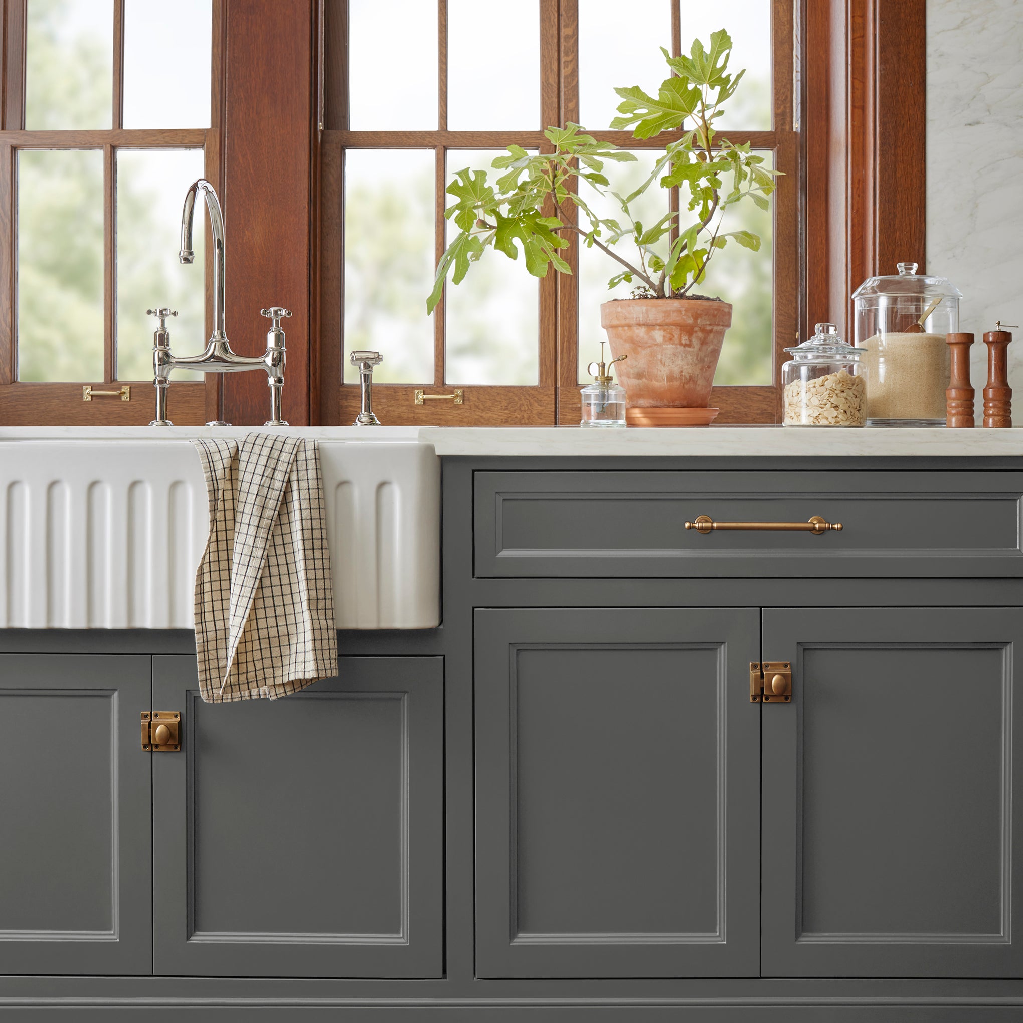 Almost black with green undertones door and cabinet paint named prairie smoke shown painted on kitchen cabinet 
