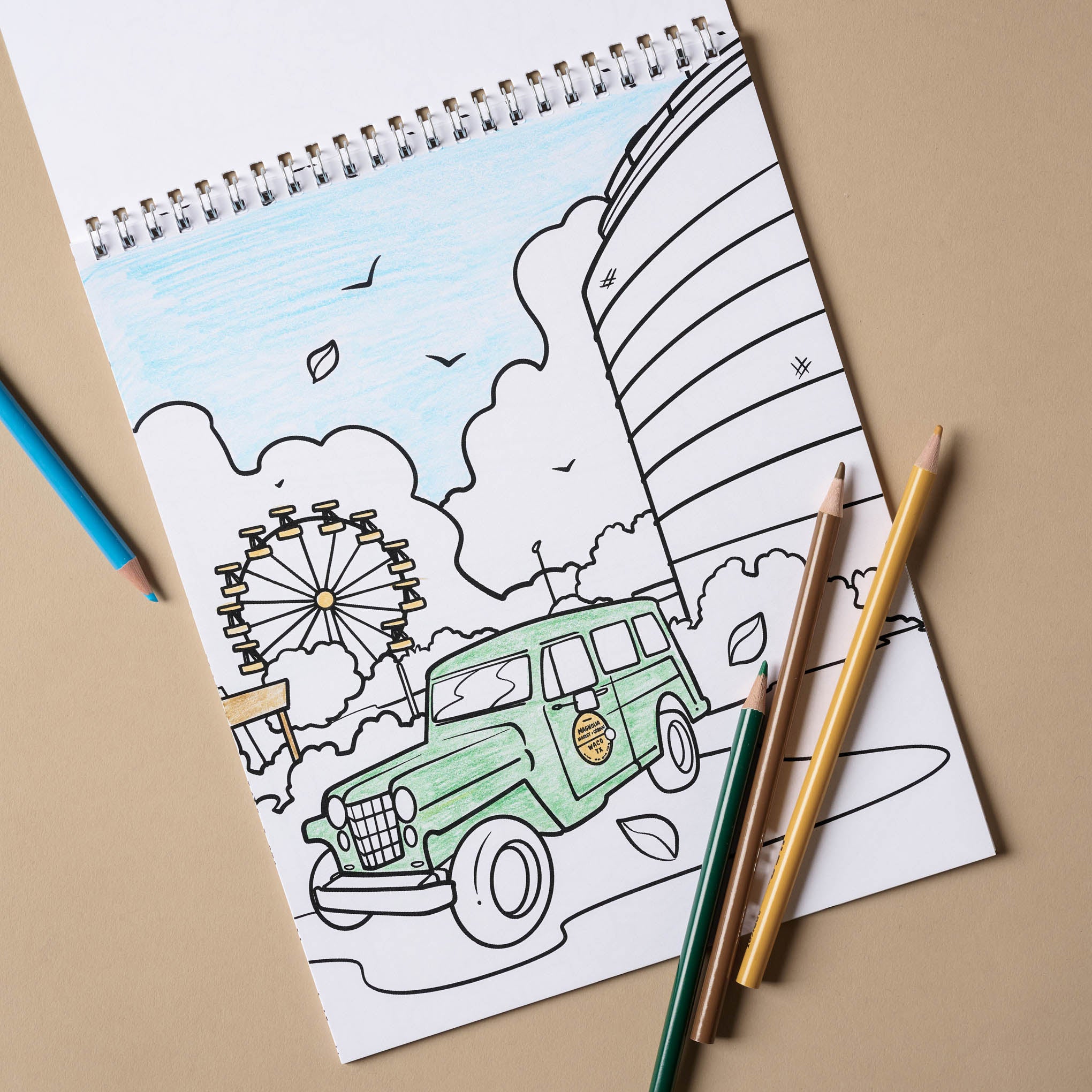 Magnoliass Coloring Book open to a page with a car 