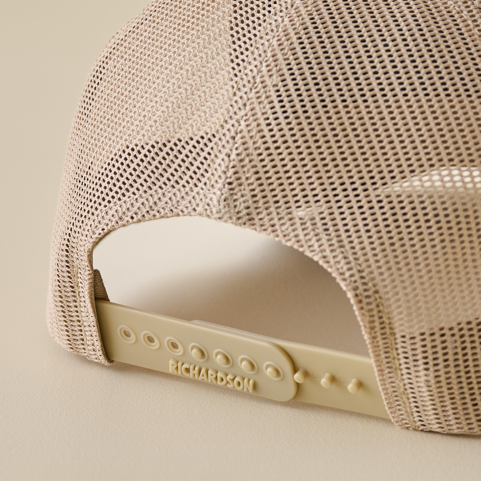 Magnoliass Brown and Khaki Leather Patch Hat snap closure up close