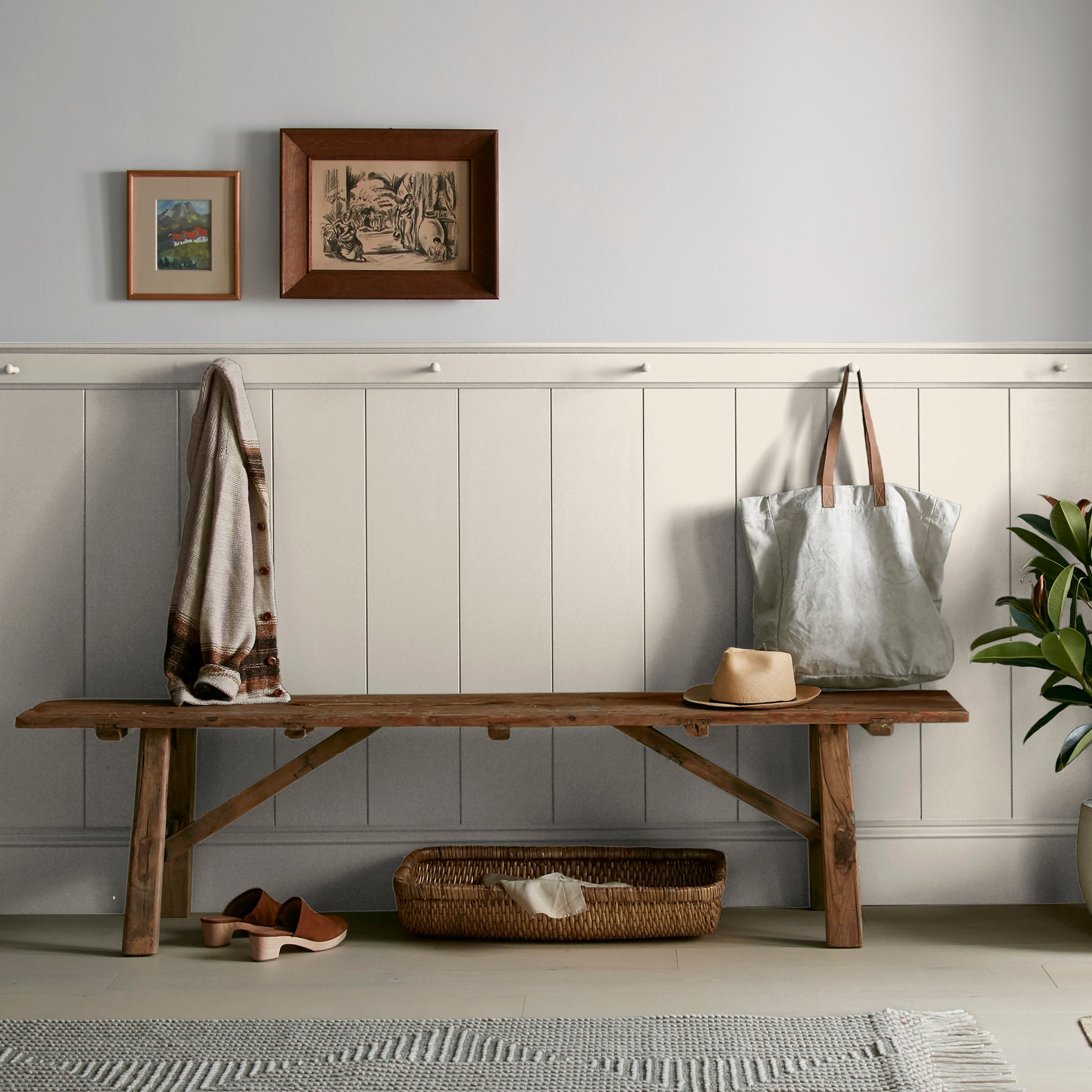 Creamy soft white interior paint named castle cream shown painted on entryway wall