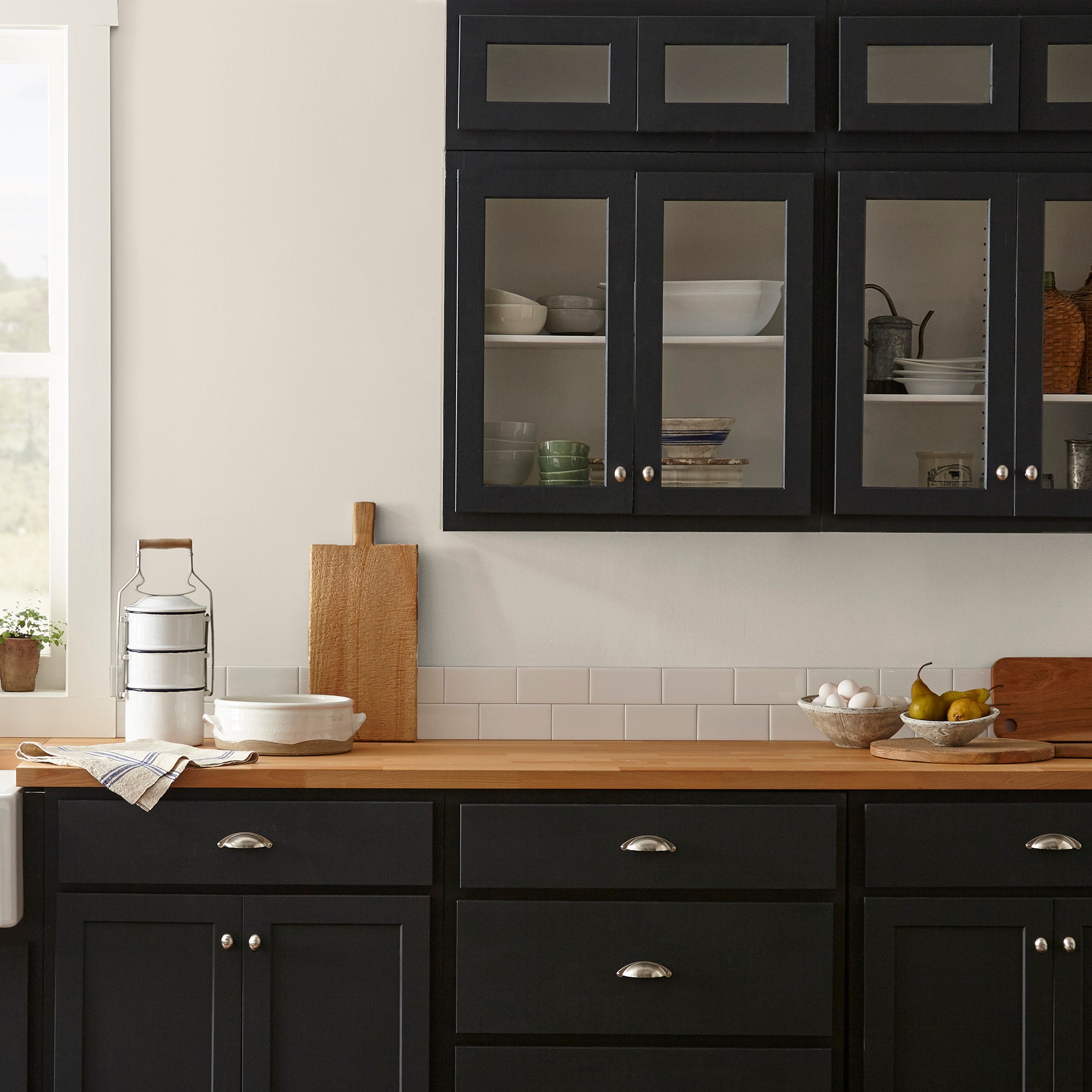 Creamy soft white interior paint named castle cream shown painted on kitchen wall