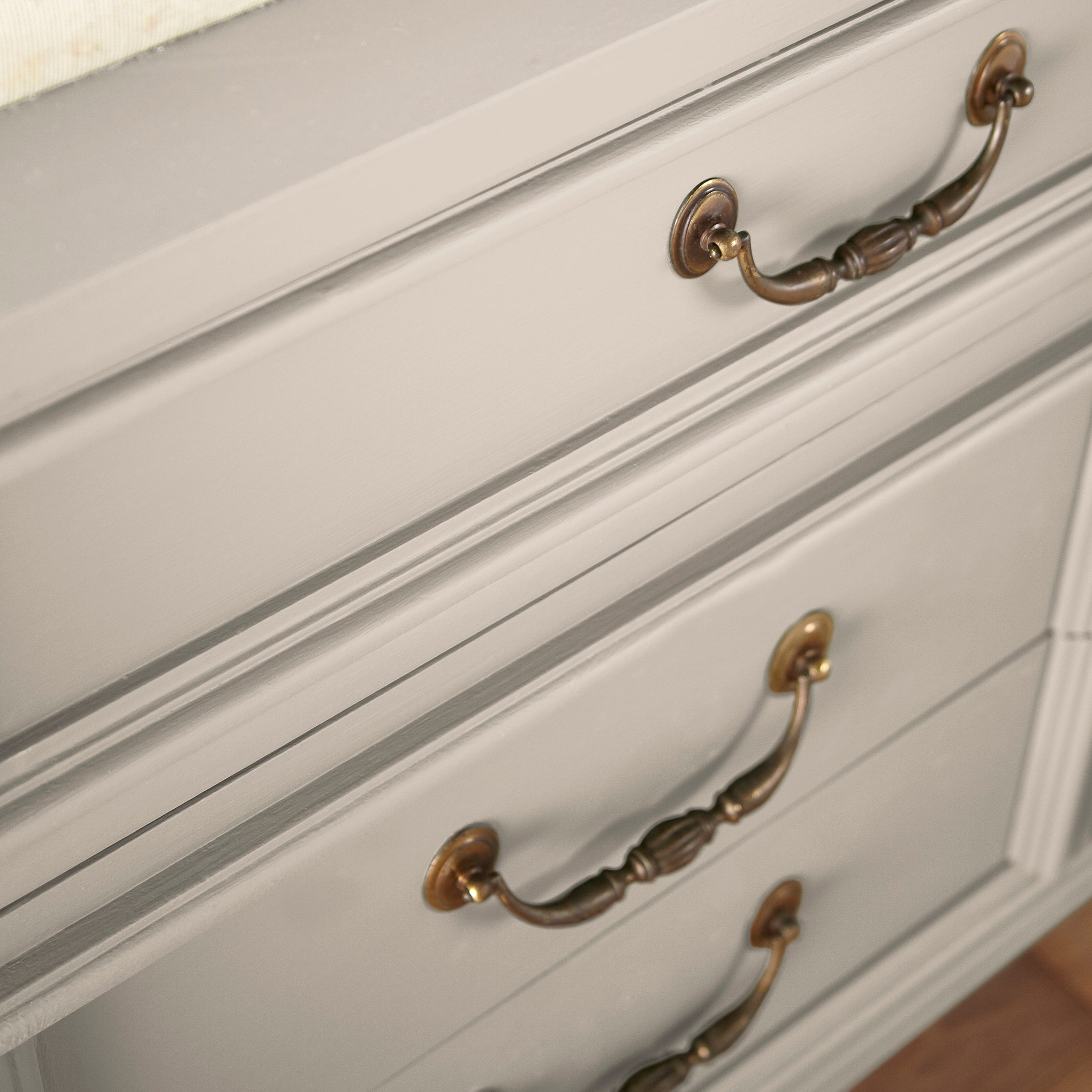 A light beige with a warm, soothing tone door and cabinet paint named plaster shown painted on cabinet