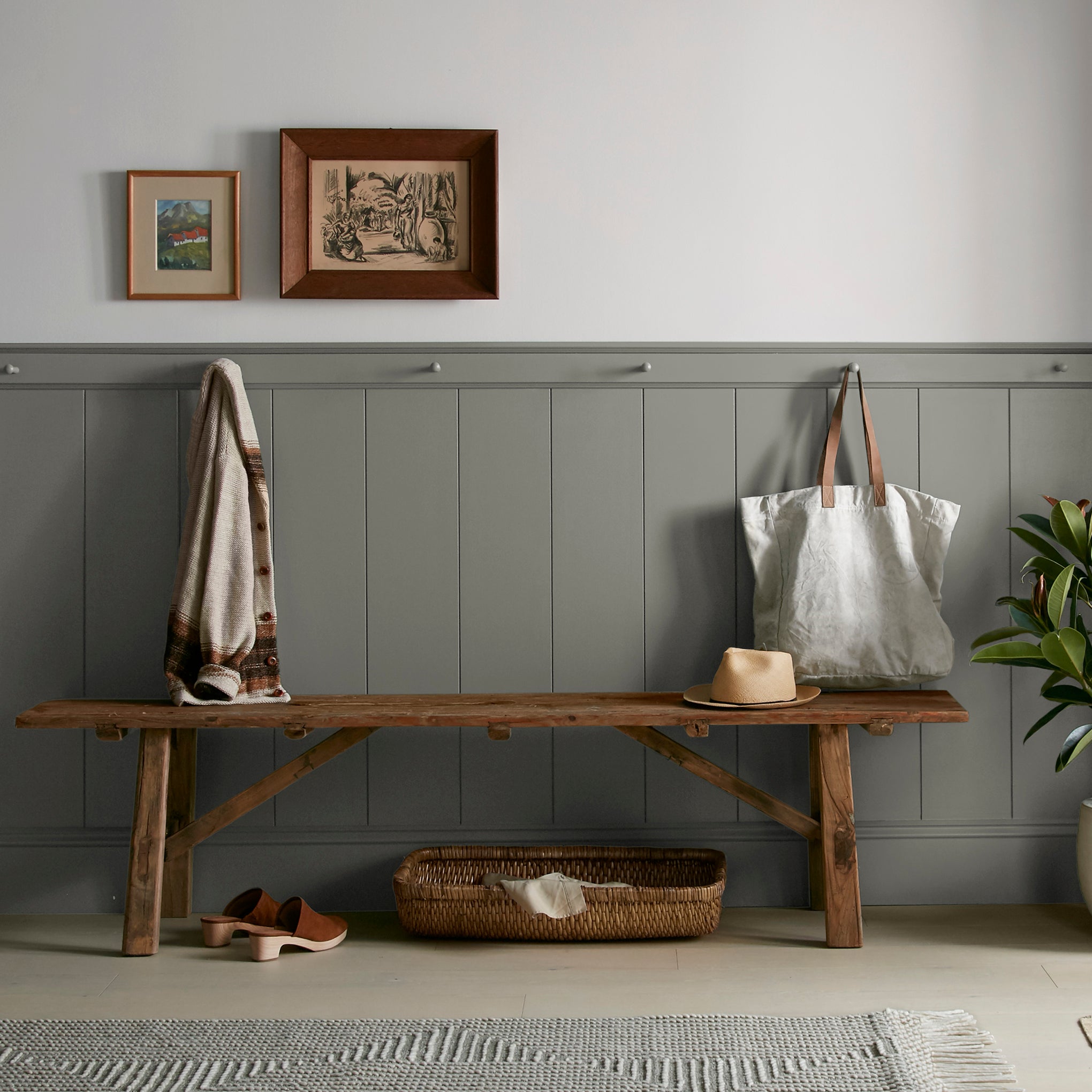 Sage green with gray undertones interior paint named estate shown painted on entryway wall