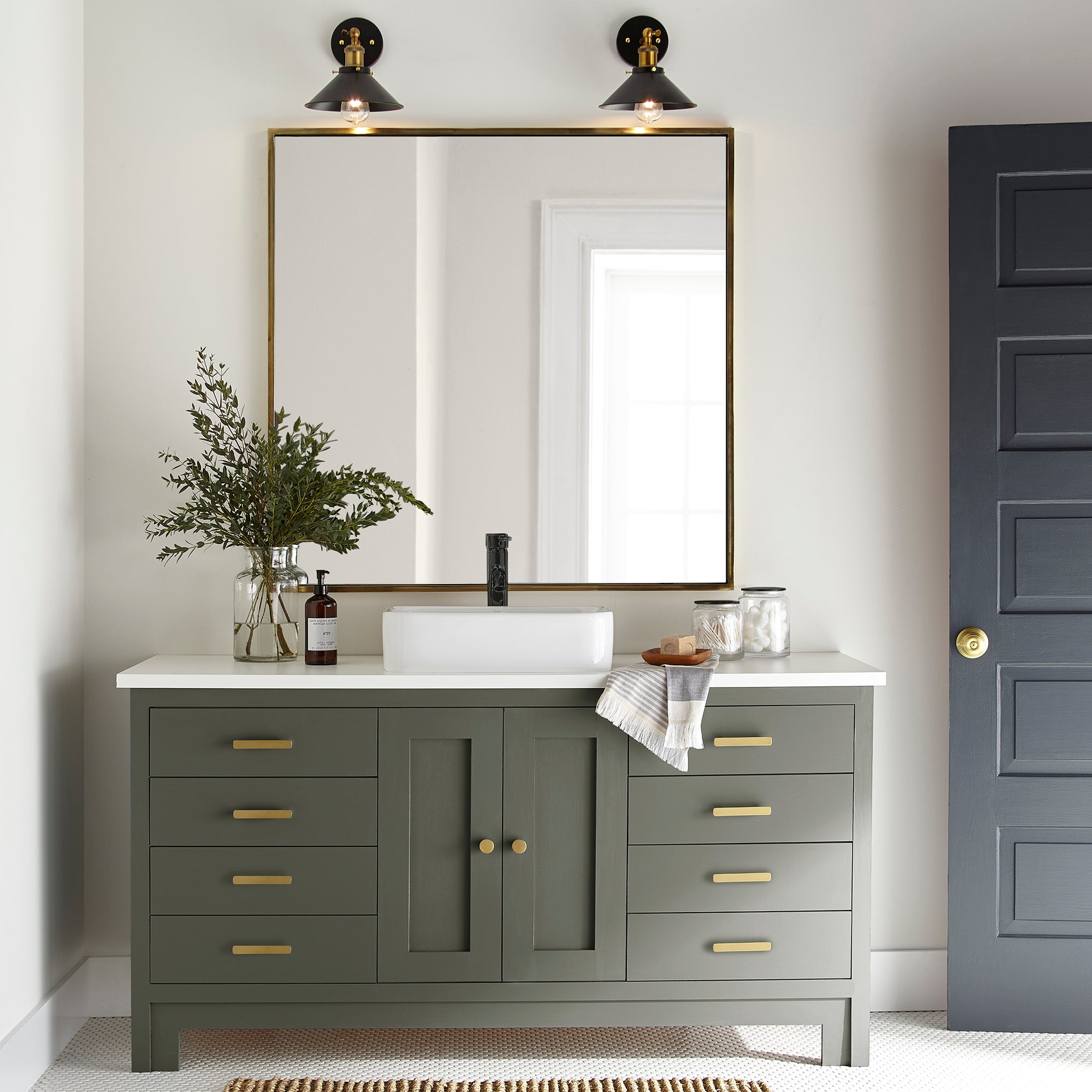 A lively, deep olive door and cabinet paint named step stool green shown painted on bathroom cabinet