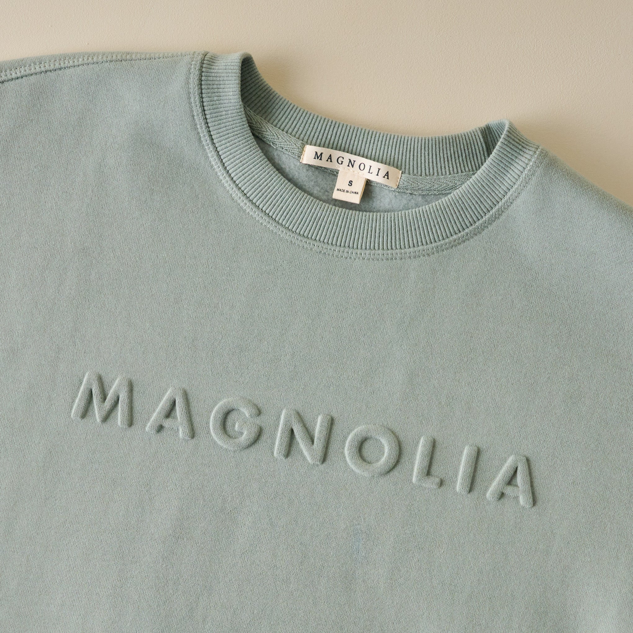 Magnoliass Embossed Green Brushed Fleece Sweatshirt up close