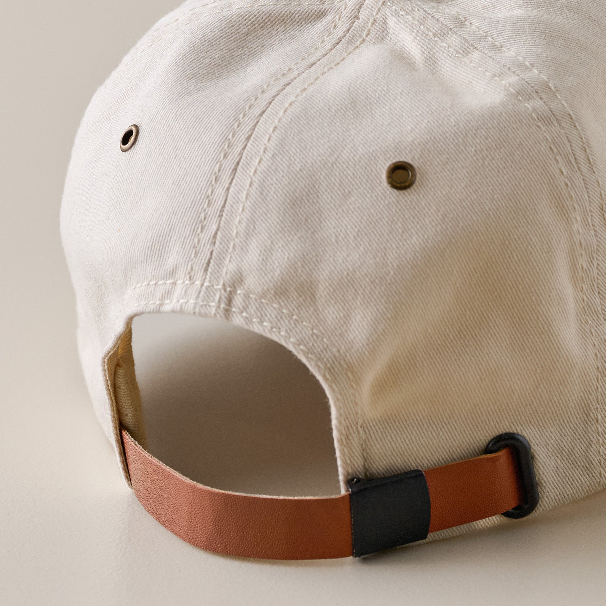 Magnoliass Ivory Twill Dad Cap closure up close