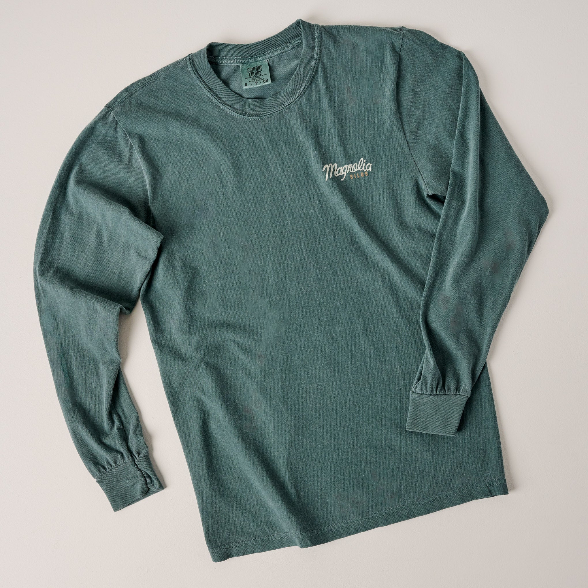Front of Magnoliass Script Silos Blue Spruce Long Sleeve Shirt