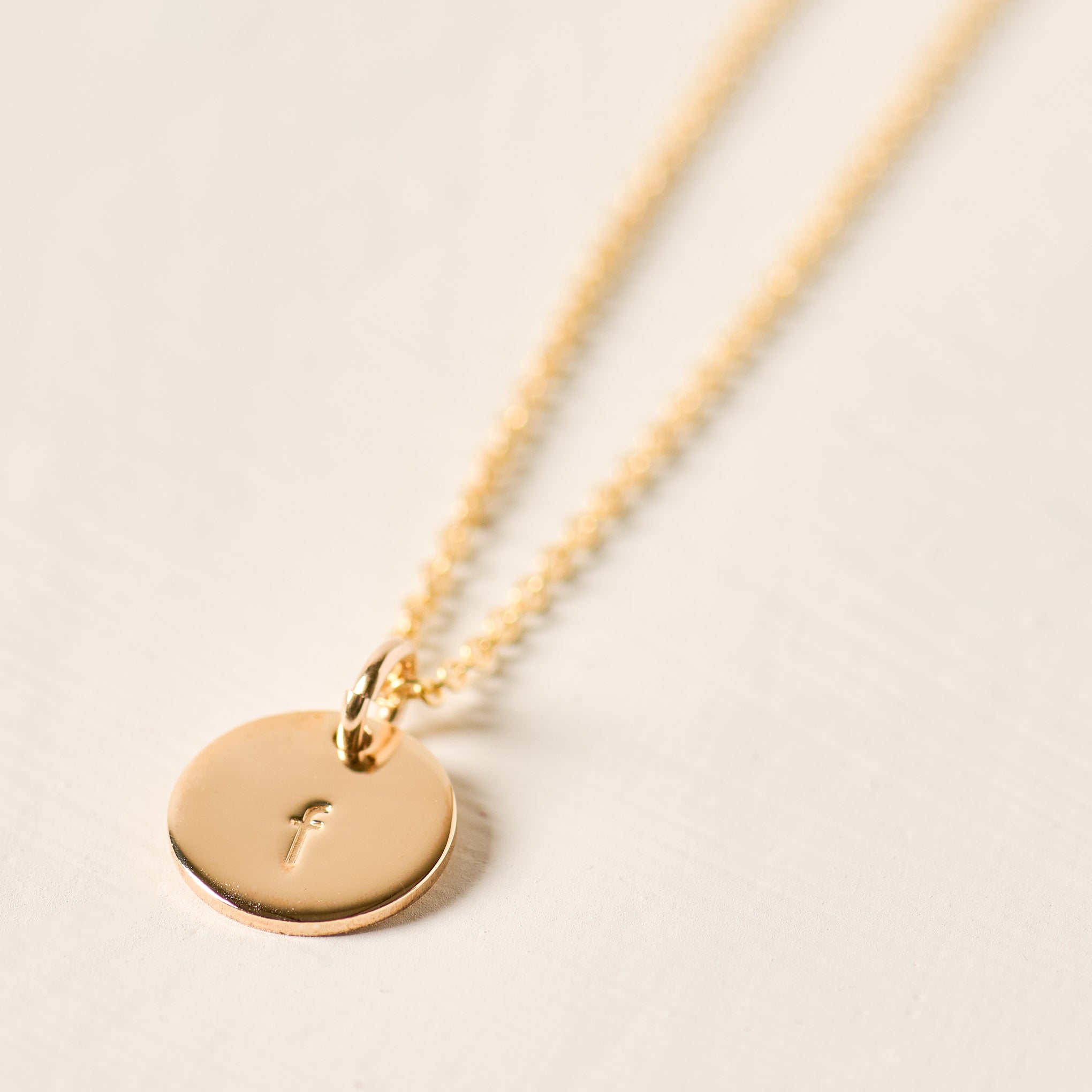 Magnoliass gold initial disc necklace
