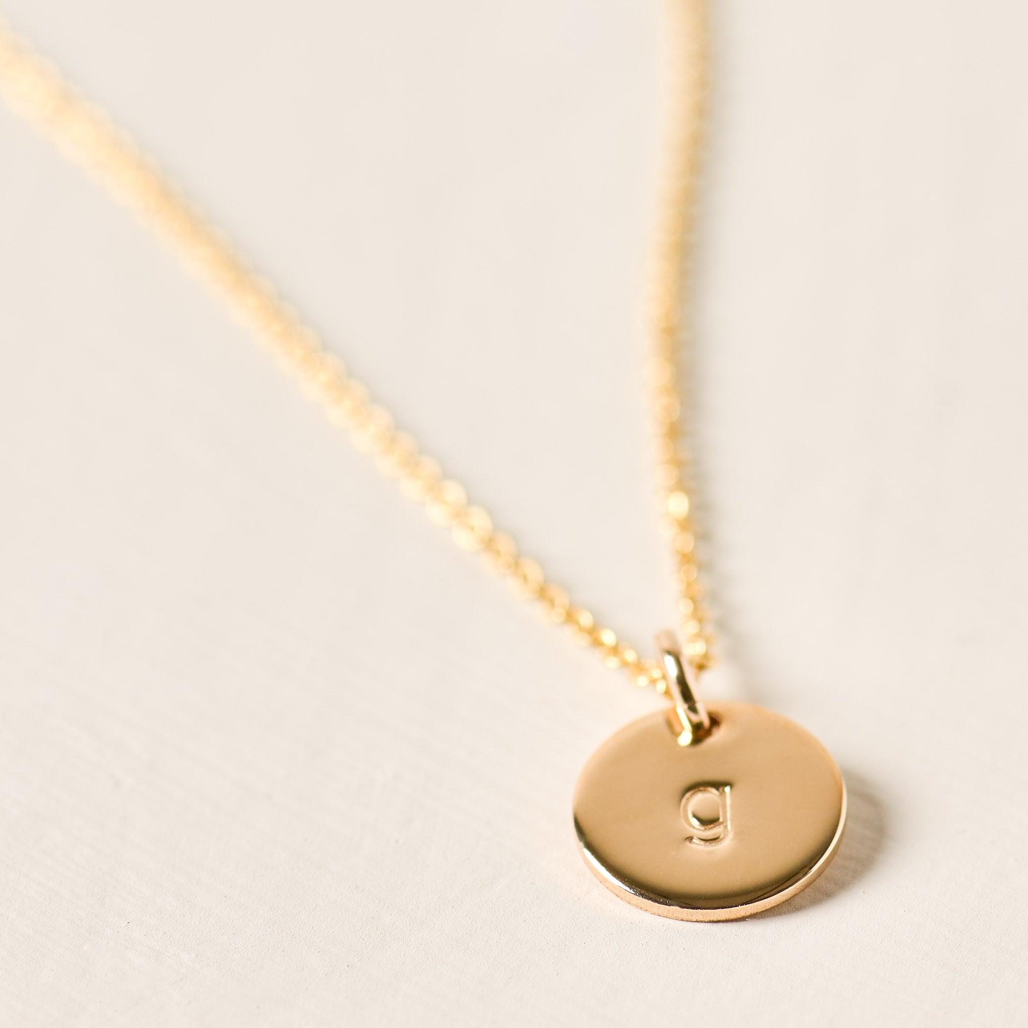 Magnoliass gold initial disc necklace