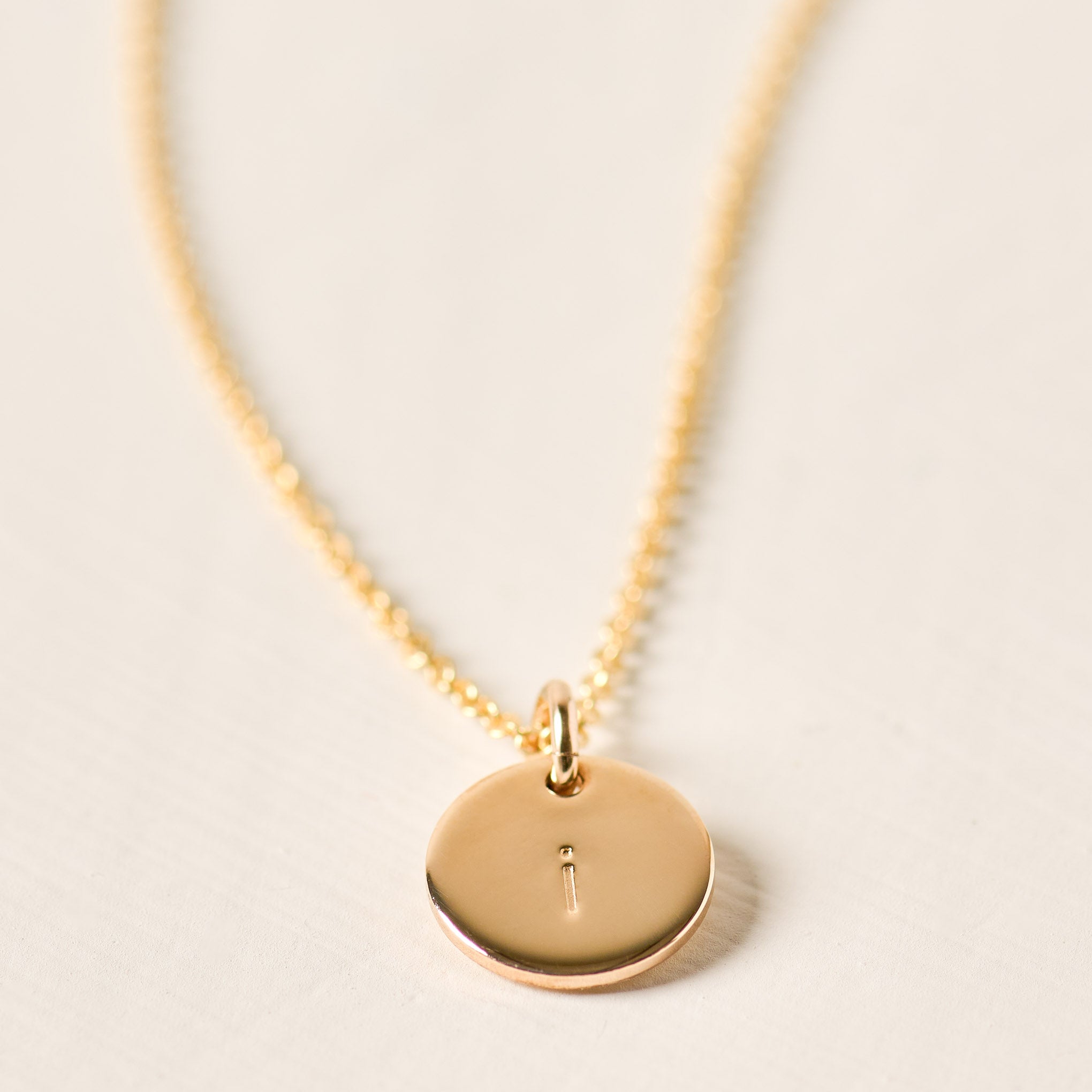 Magnoliass gold initial disc necklace