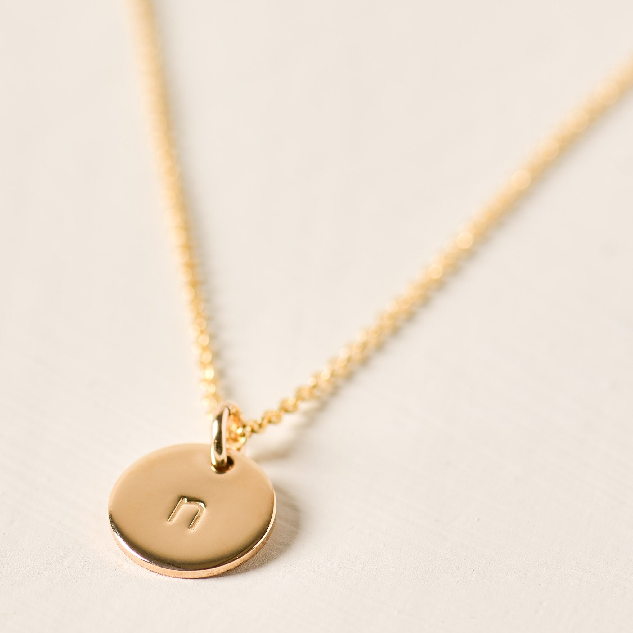 Magnoliass gold initial disc necklace