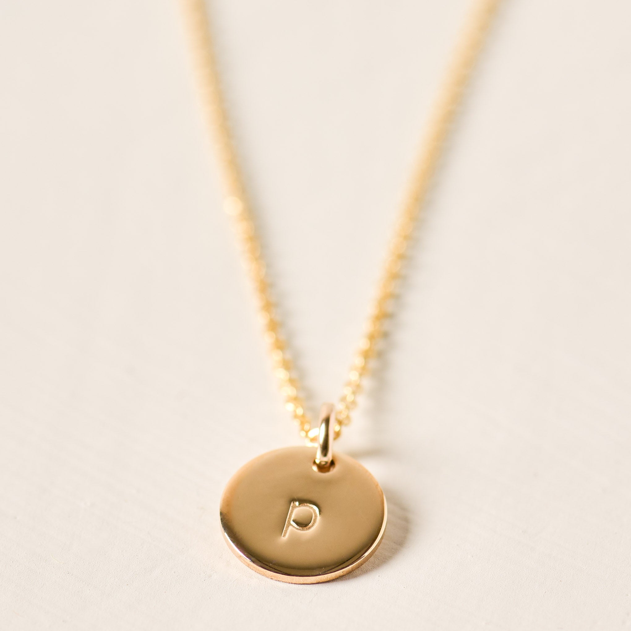 Magnoliass gold initial disc necklace