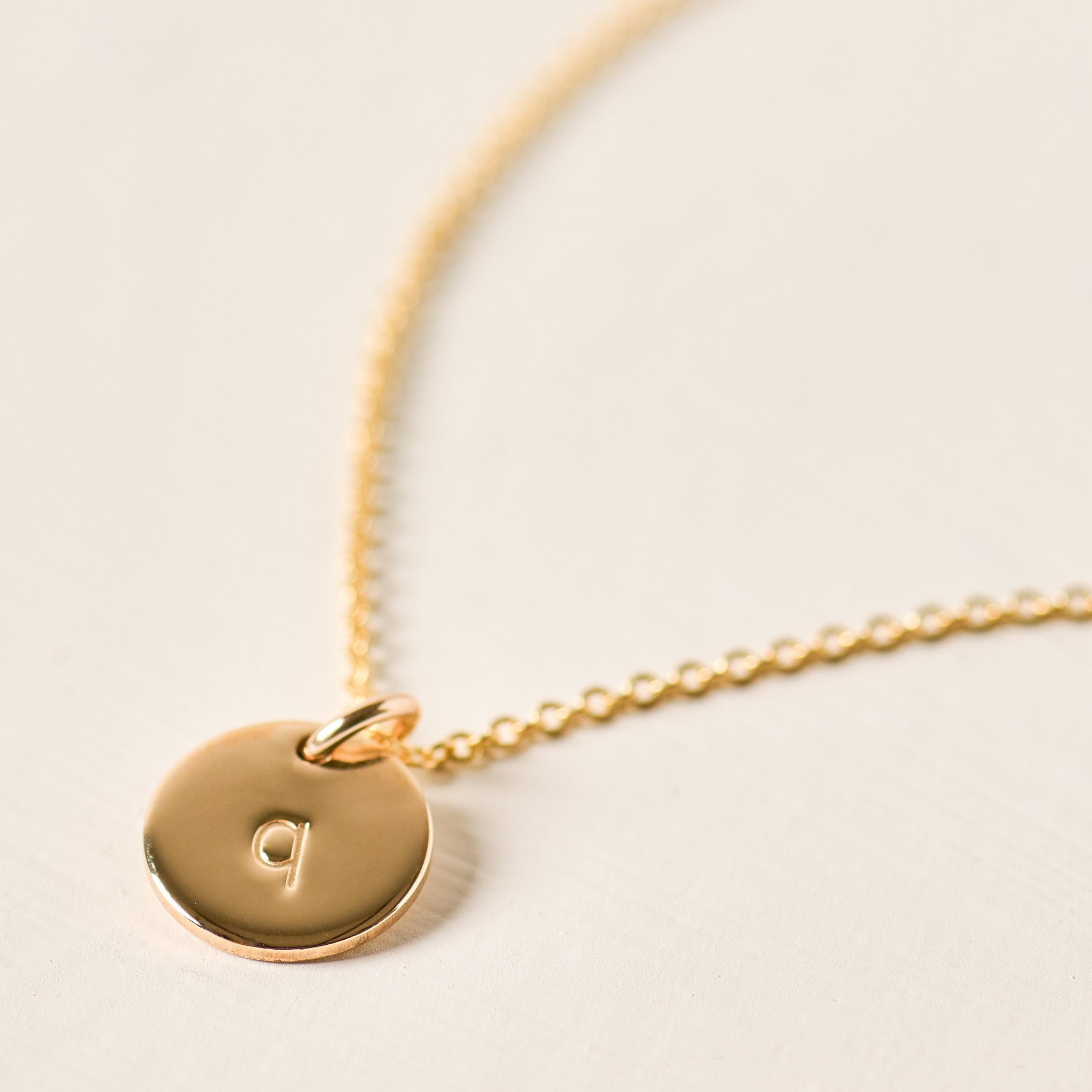 Magnoliass gold initial disc necklace