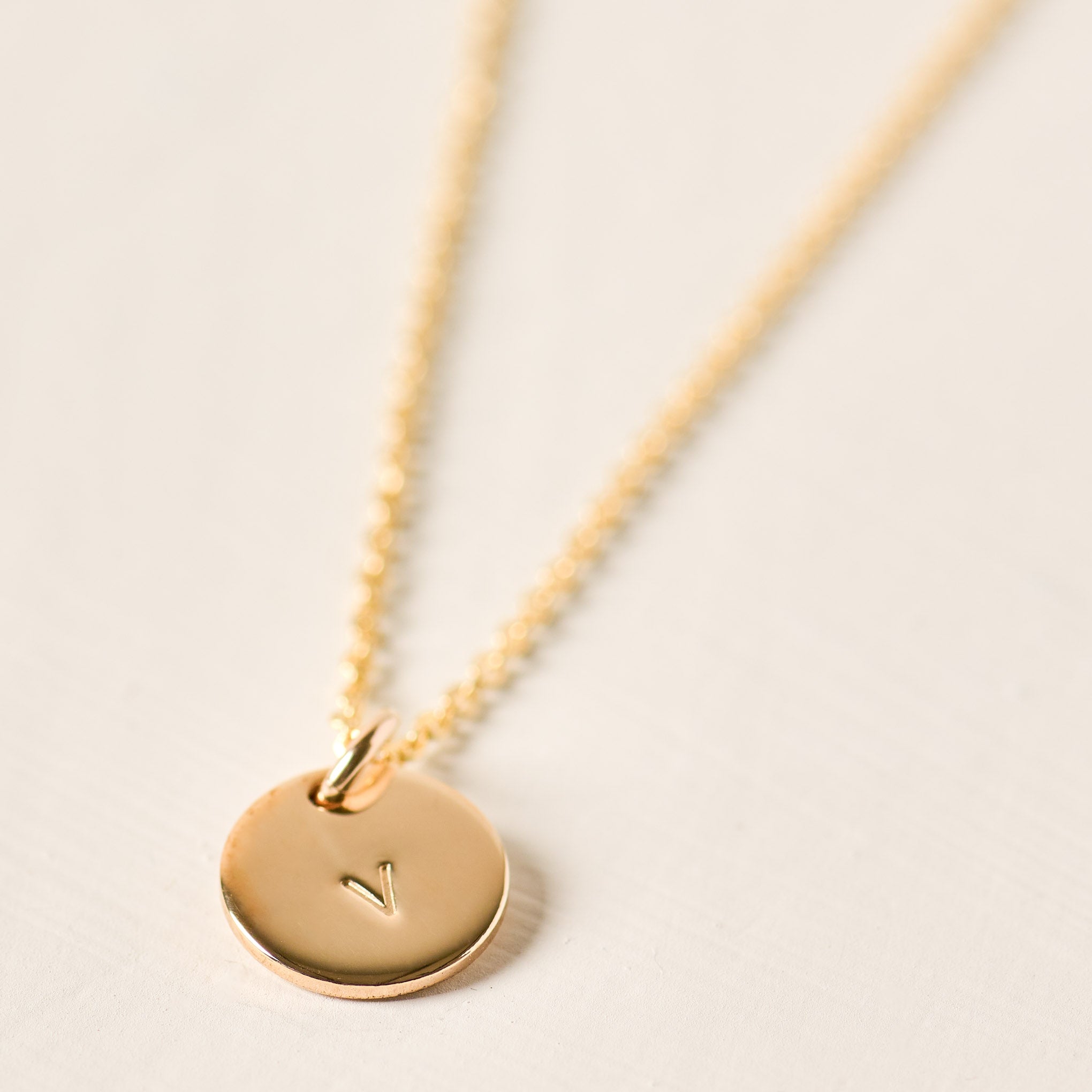 Magnoliass gold initial disc necklace