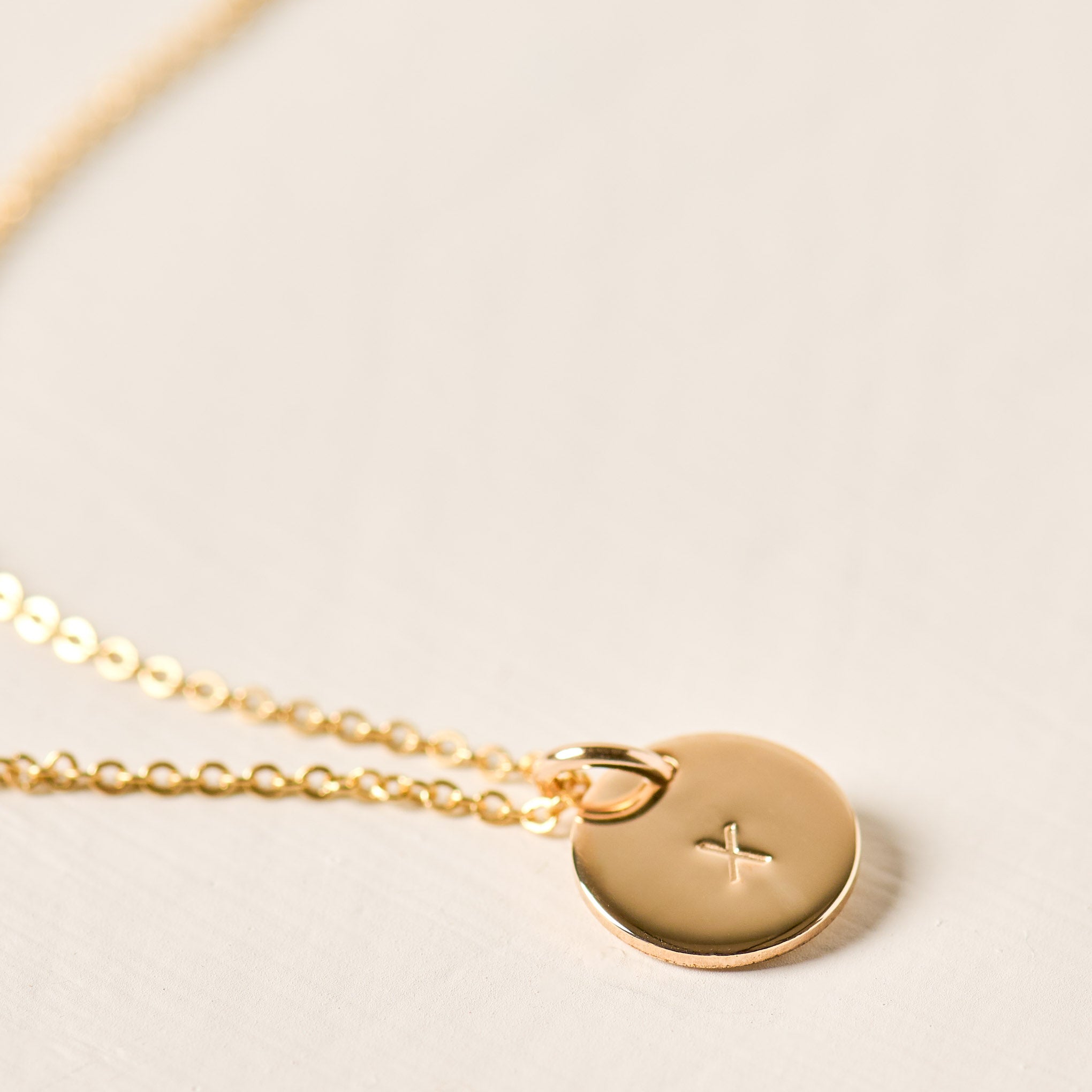 Magnoliass gold initial disc necklace