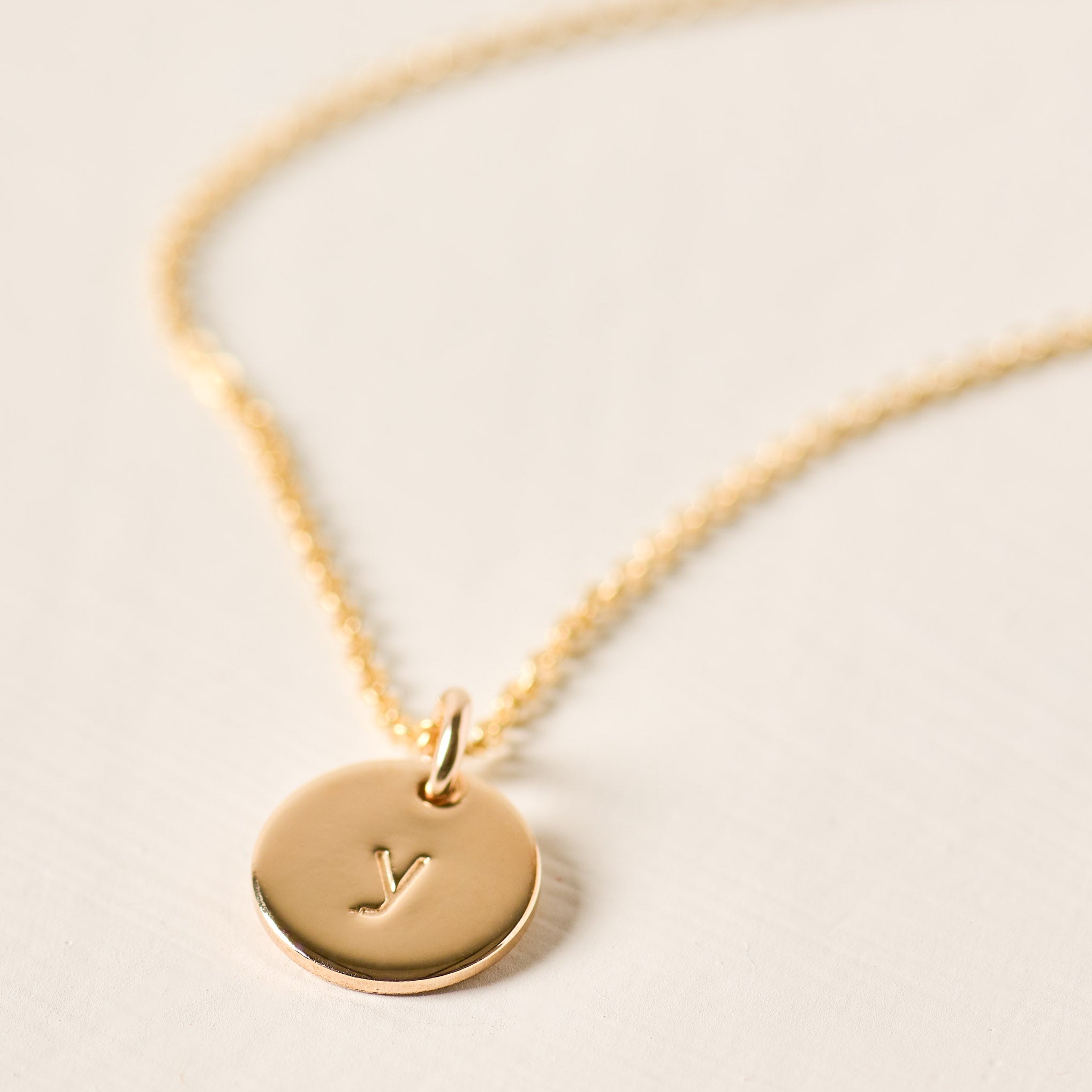 Magnoliass gold initial disc necklace