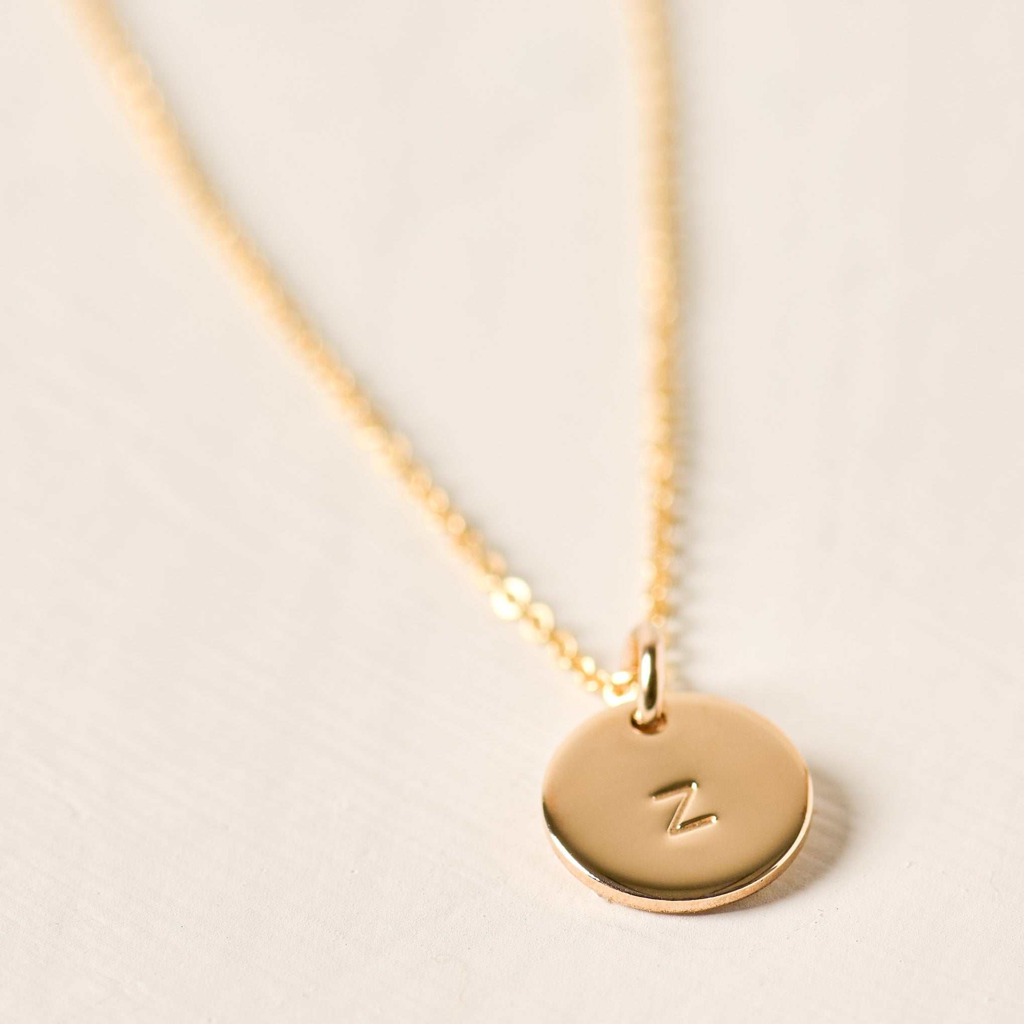 Magnoliass gold initial disc necklace