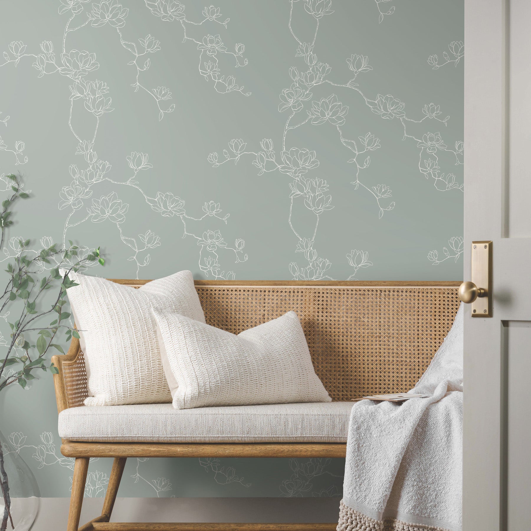 Magnoliass Branches Wallpaper in eucalyptus shown in room