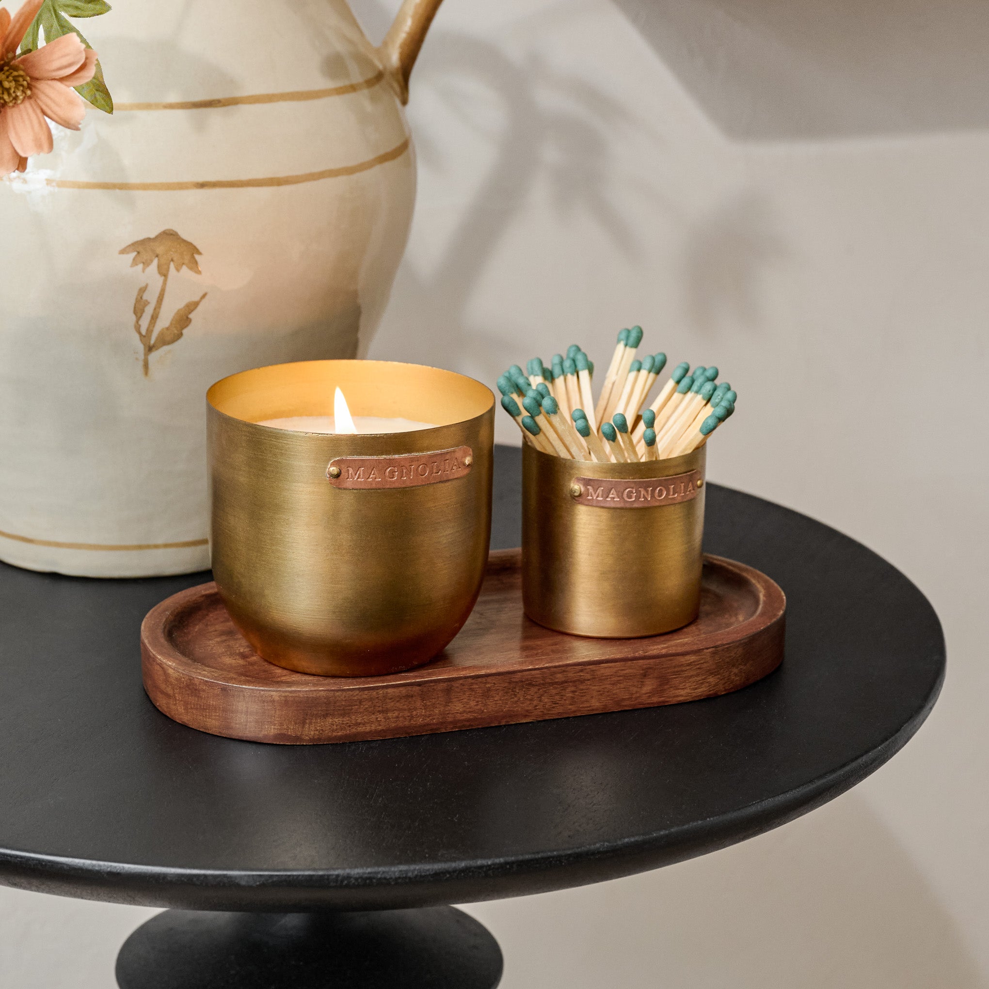 Magnoliass Santalum Brass and Copper Candle Set shown on table