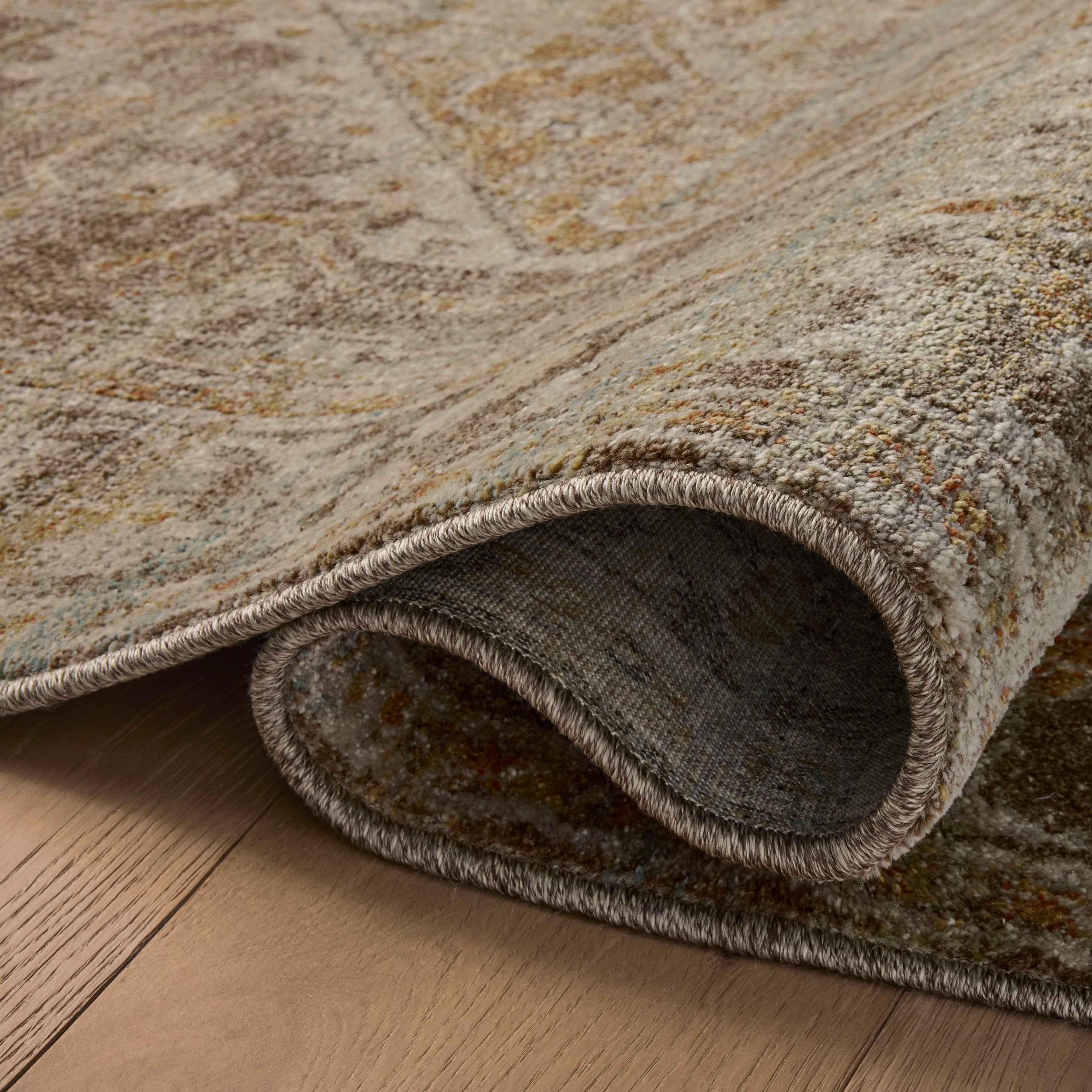 Mona Bark Sunrise Rug close up of rolled rug