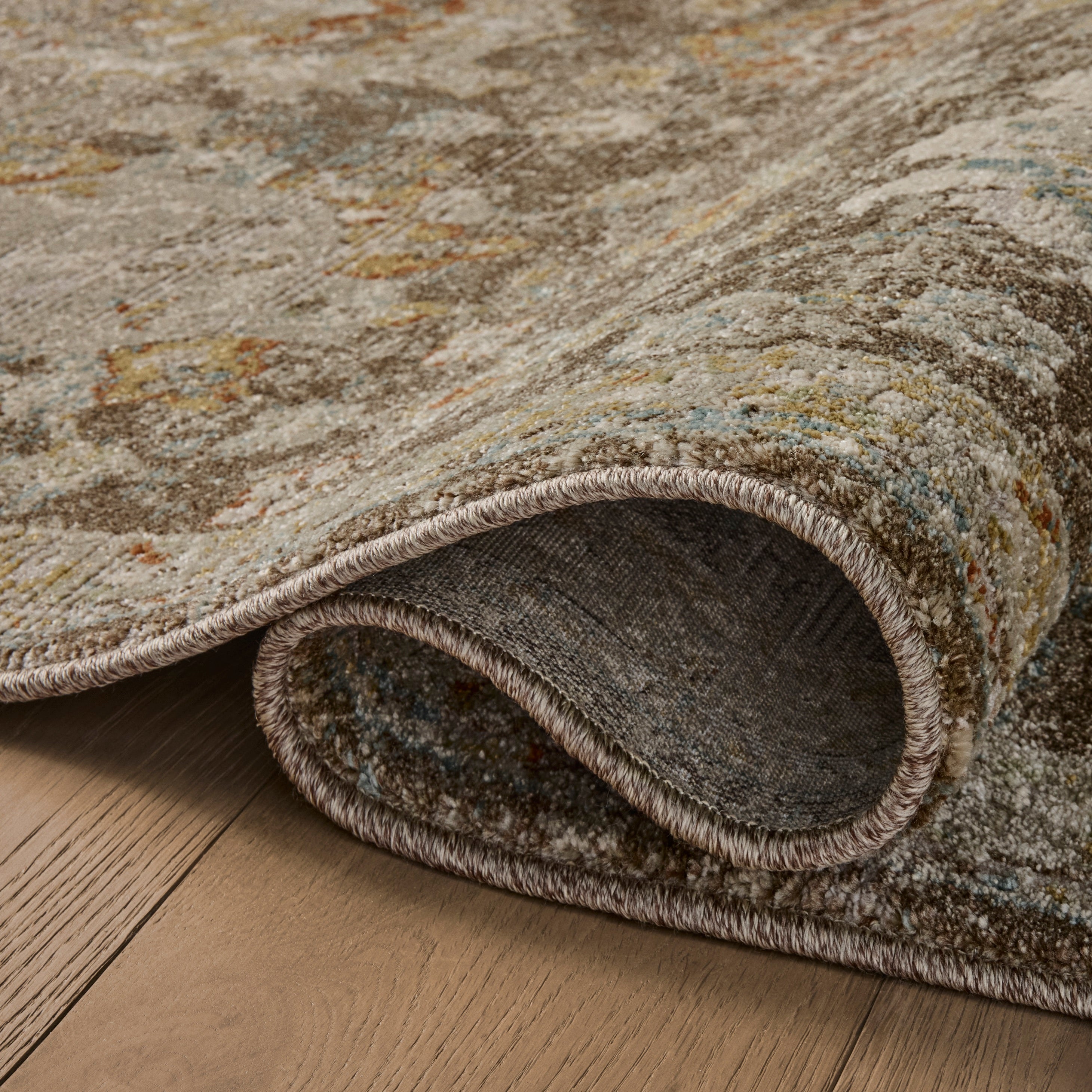 Mona Bark Multi Rug close up of rolled rug