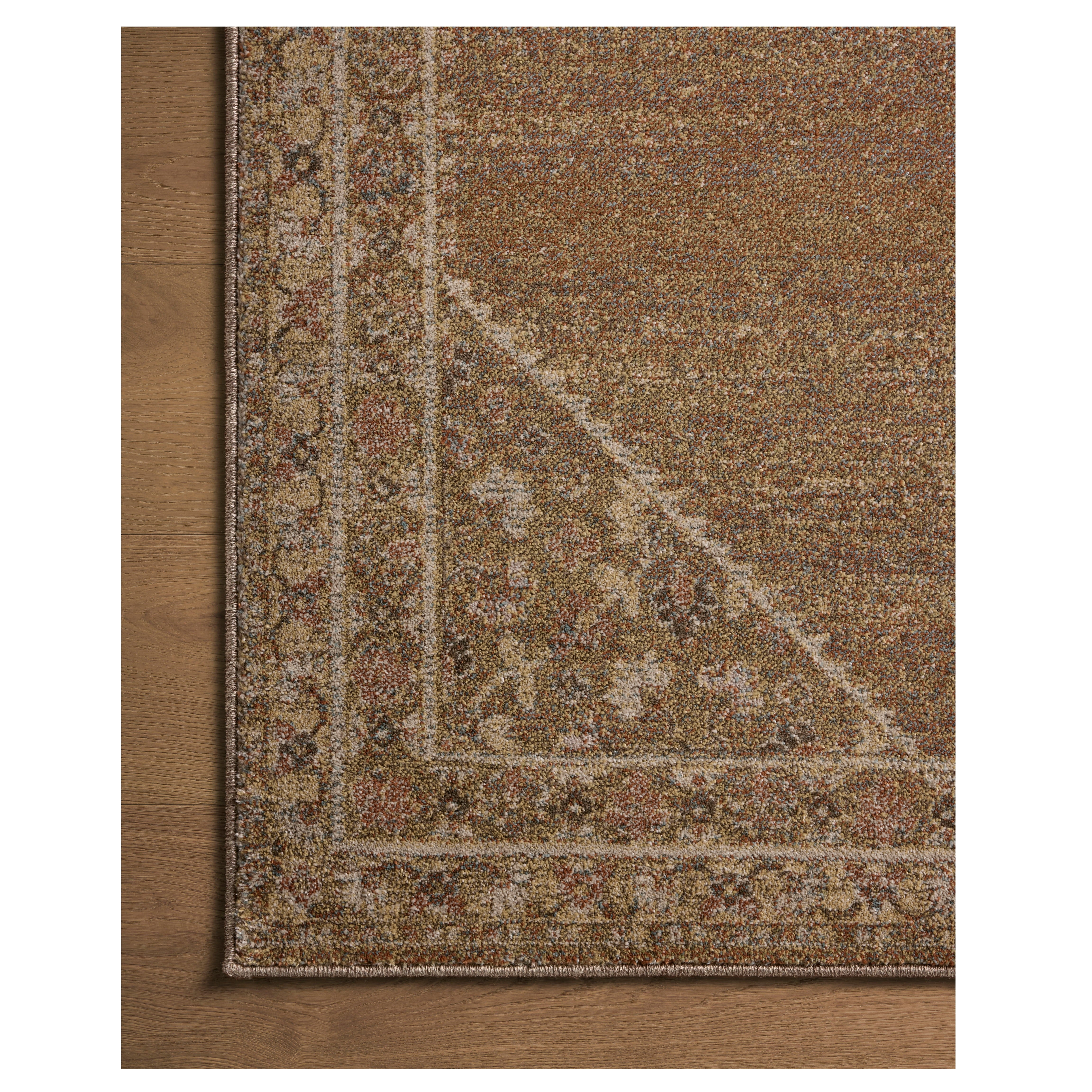 Mona Sunset Natural Rug close up of corner on wood floor
