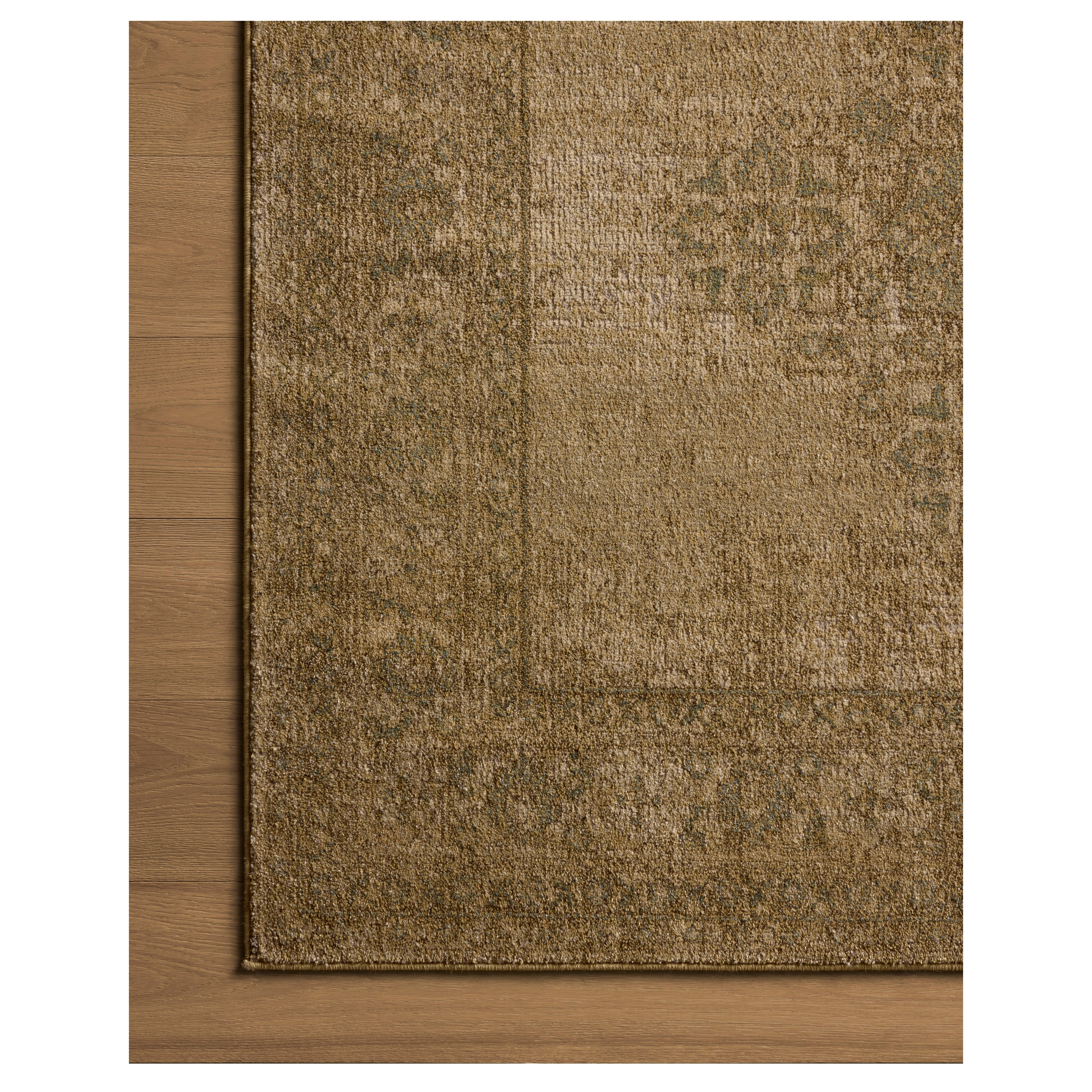 Mona Antique Spa Rug close up of corner on wood floor