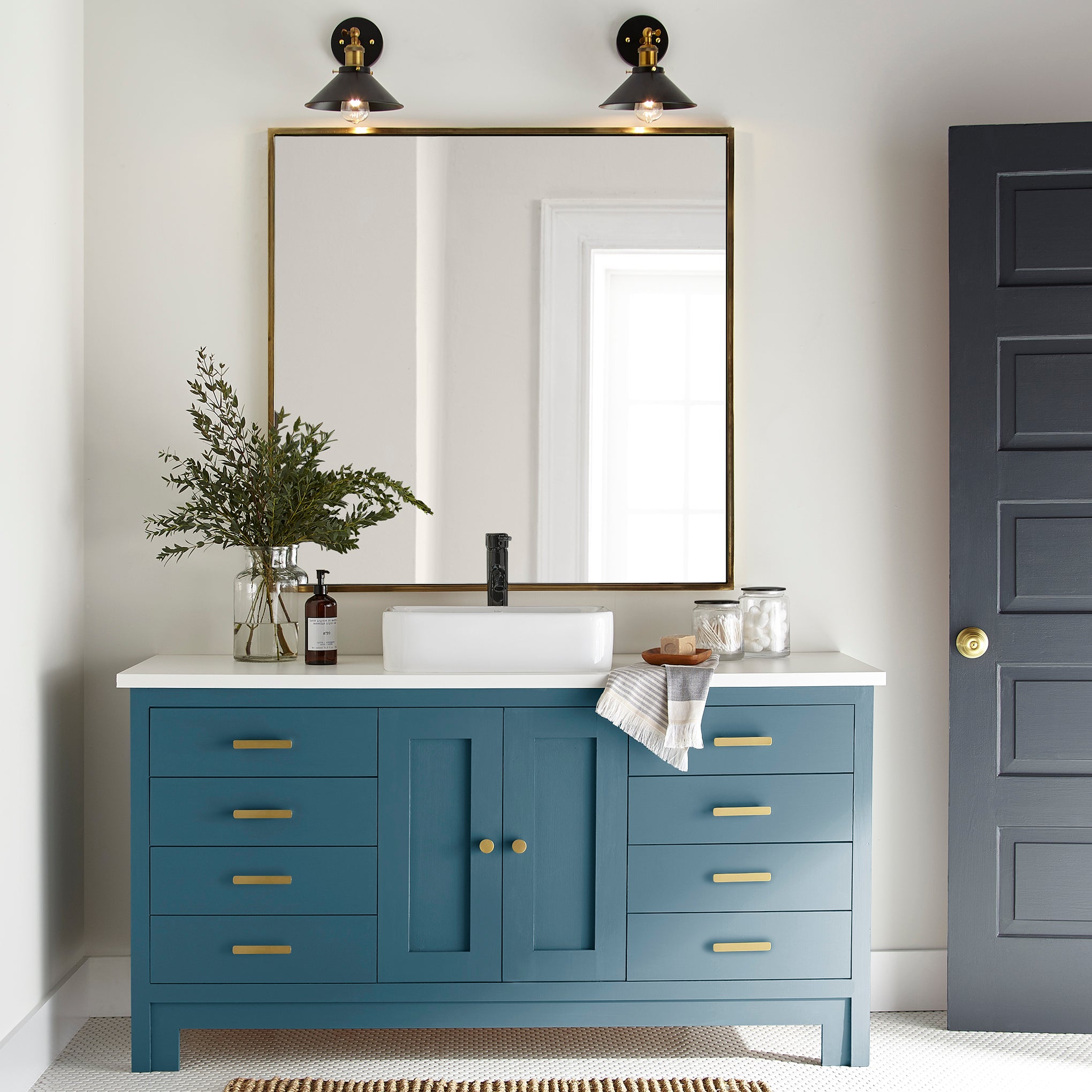 true blue paint color named superior shown painted on bathroom cabinets