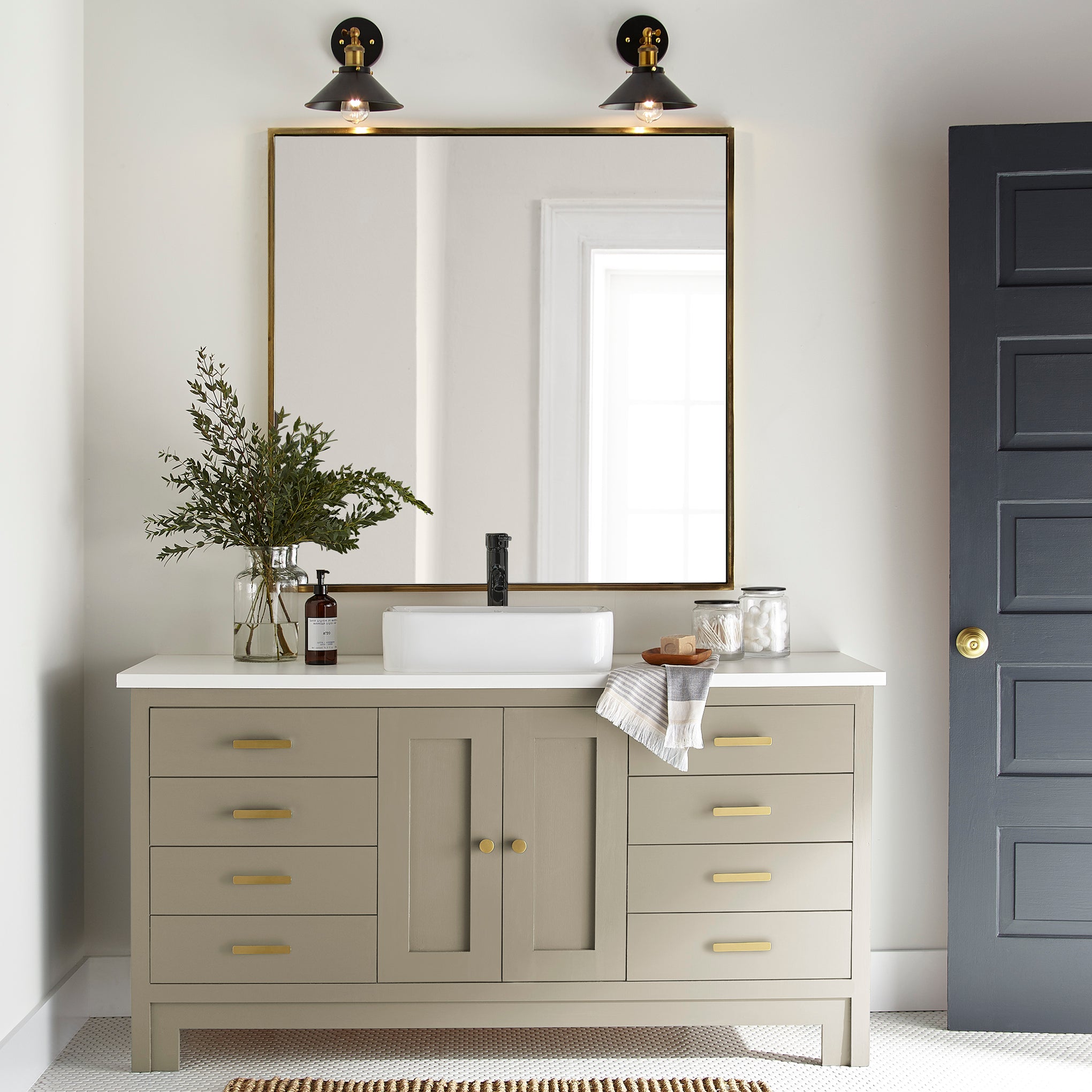 sunwashed green paint color named juniper tree shown painted on bathroom cabinet