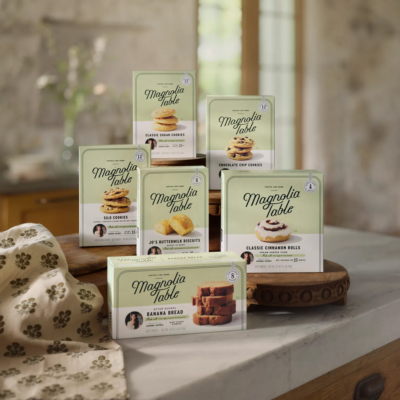 Collection of all six Magnoliass Table Frozen Food product packages on a kitchen counter.