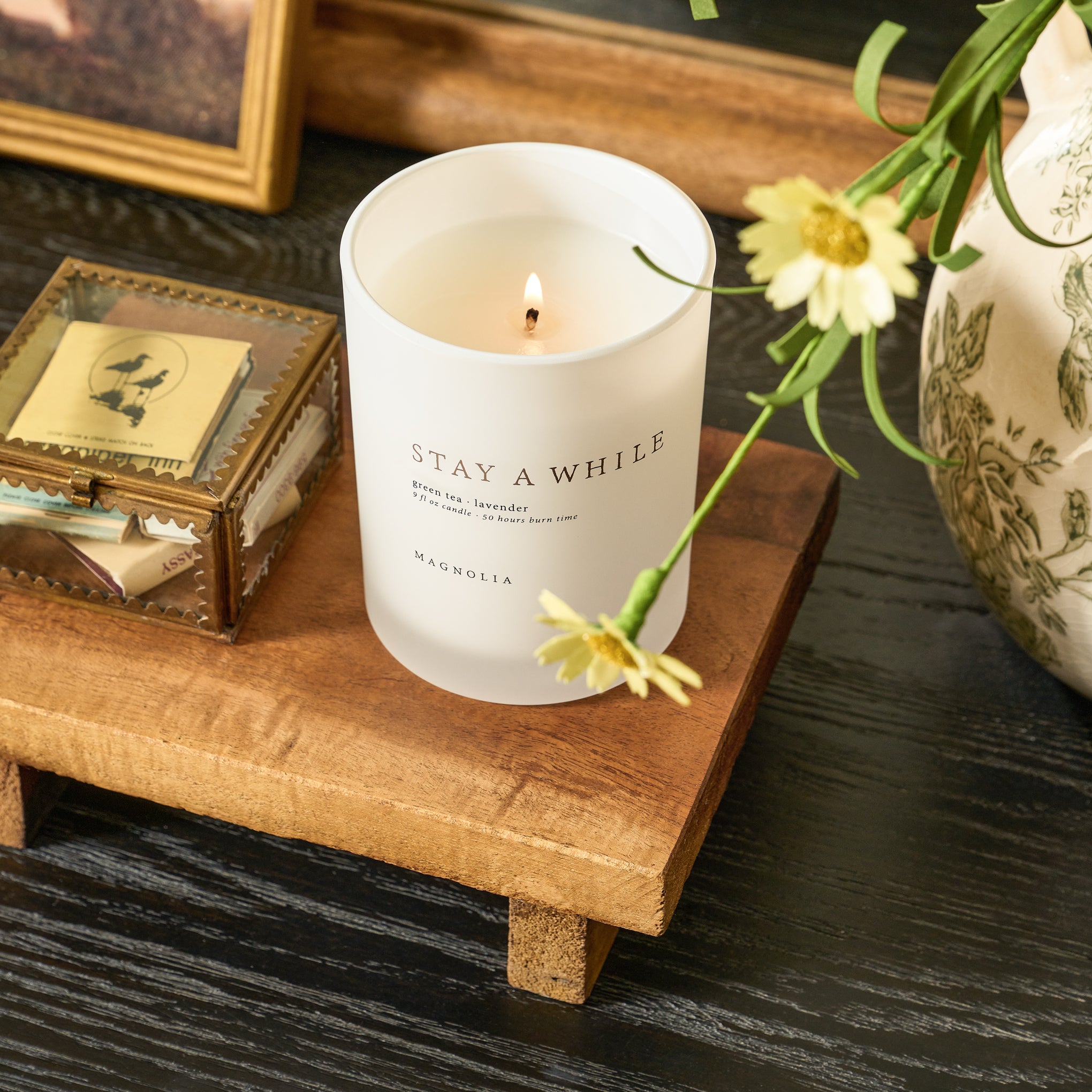 candle and keepsake box sitting on repurposed wooden riser