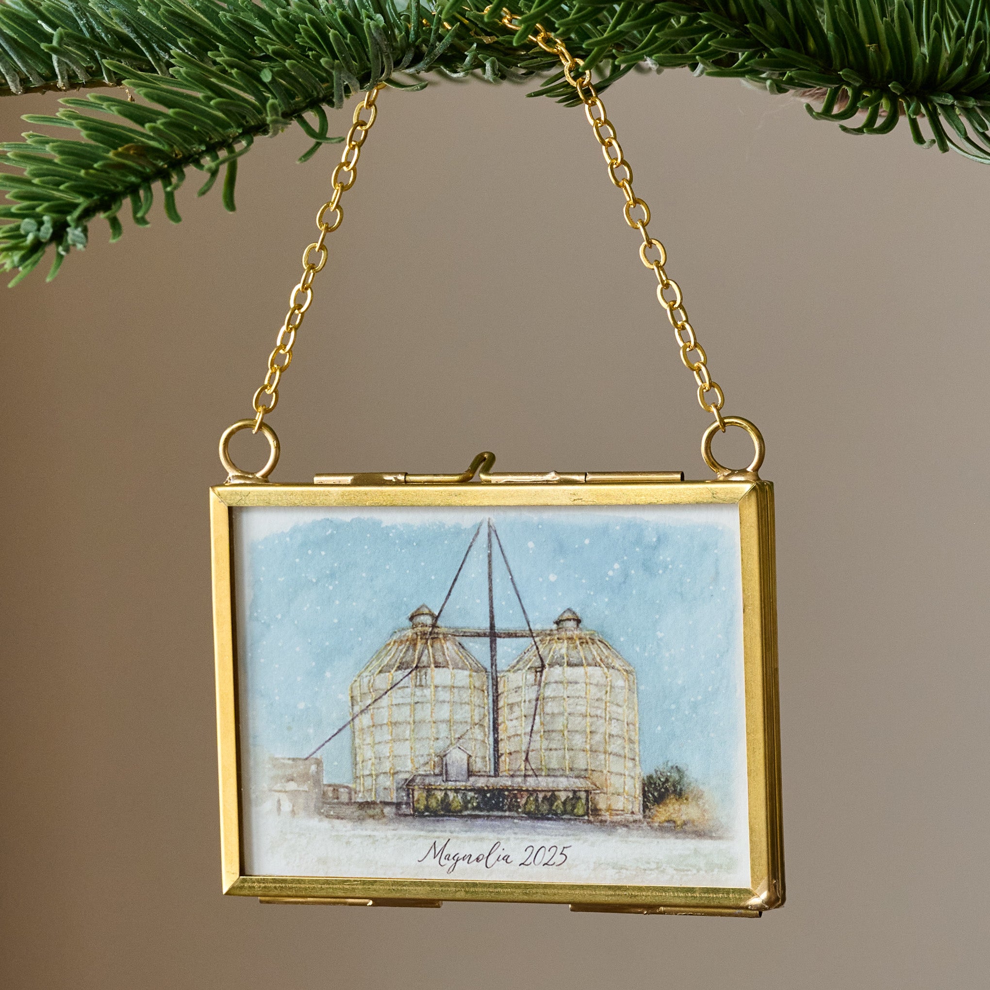 Magnoliass 2025 Limited Edition Mini Framed Ornament by Tabitha Paige shown hung from branch