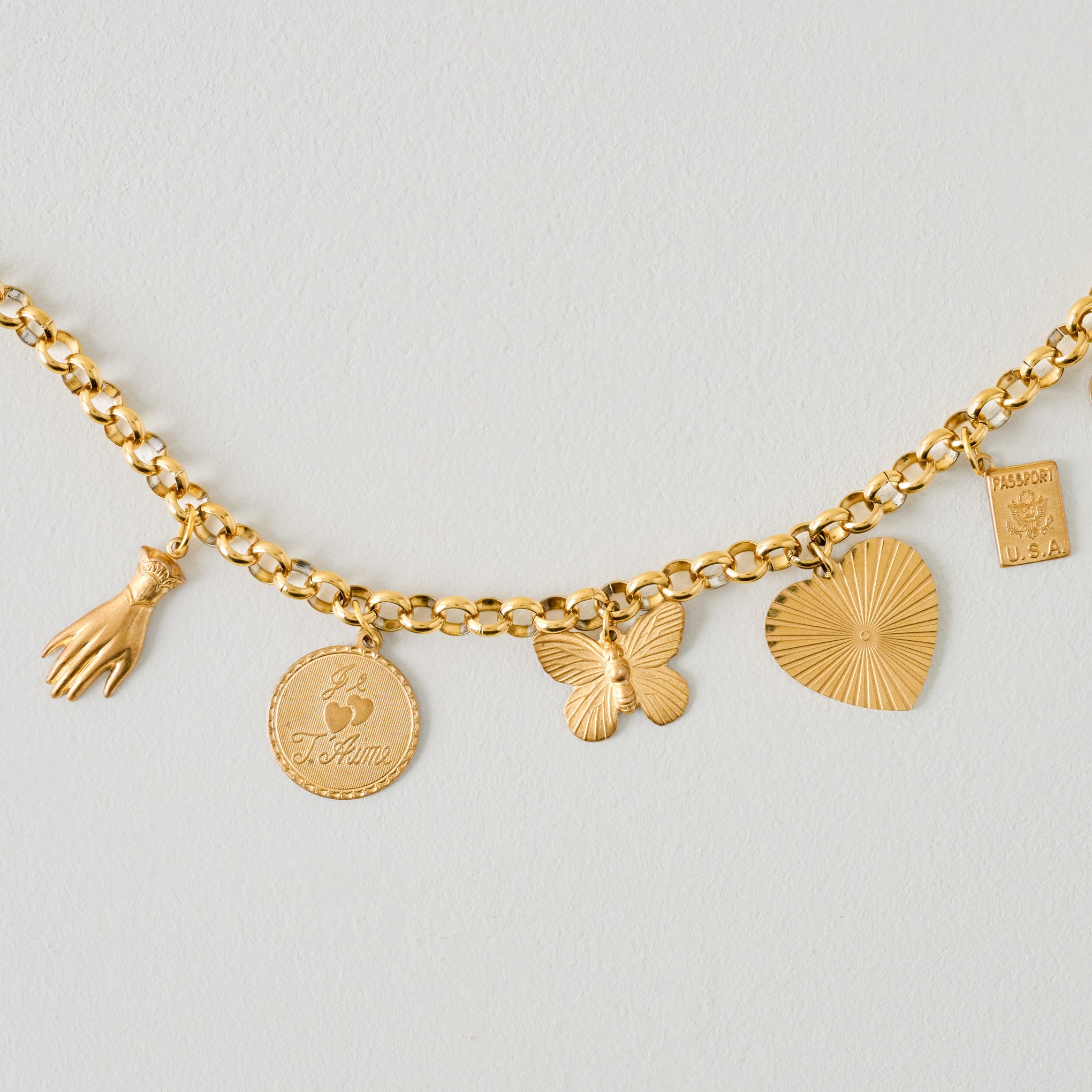 Stationary Brass Charm Necklace up close