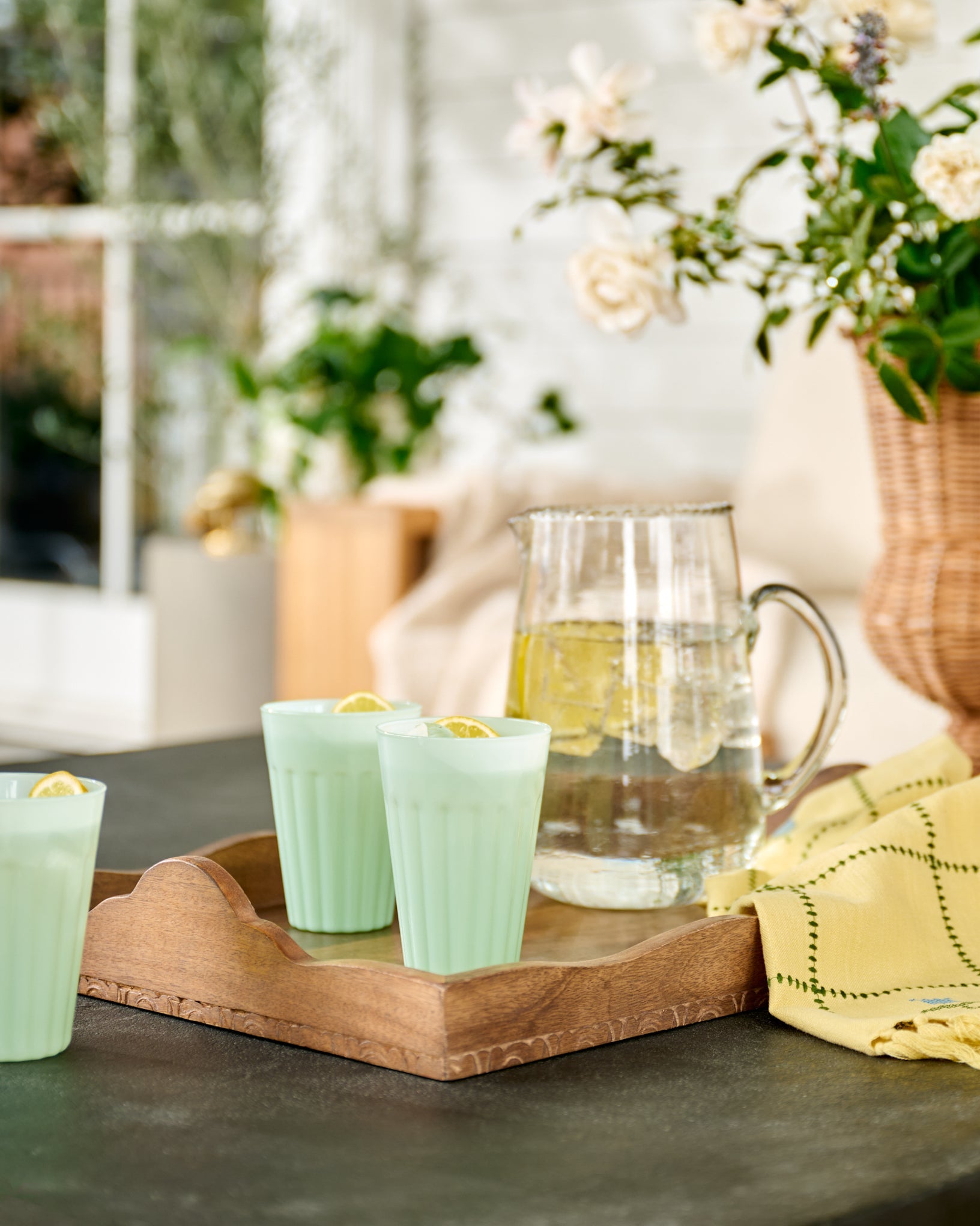 Light Green Milk Glass Tumbler on outdoor patio and wood tray