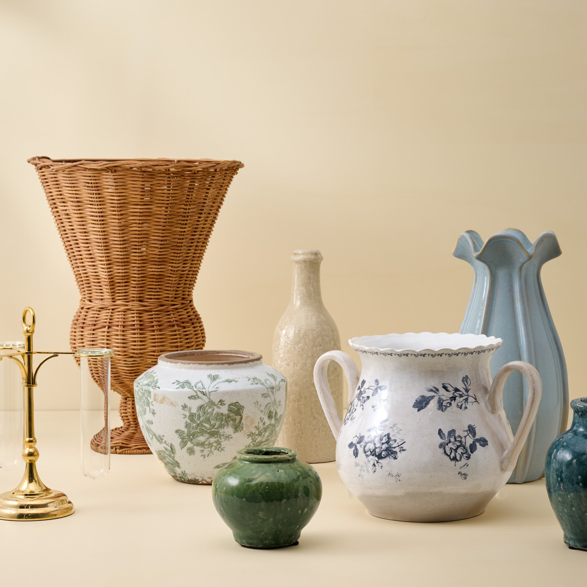 Cream Crackle Bottle Vase shown with other vases
