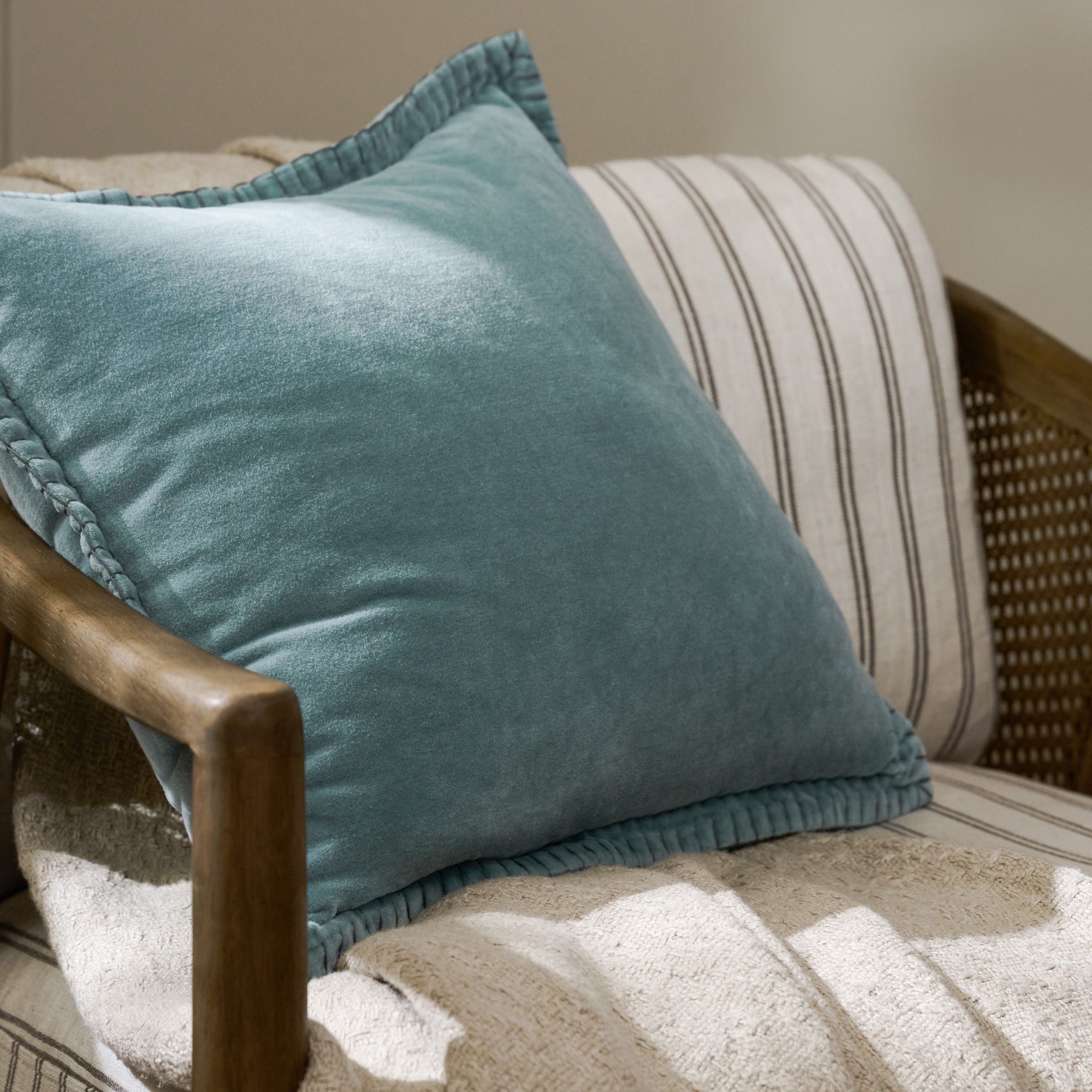 Townes Smoke Blue Velvet Pillow on accent chair