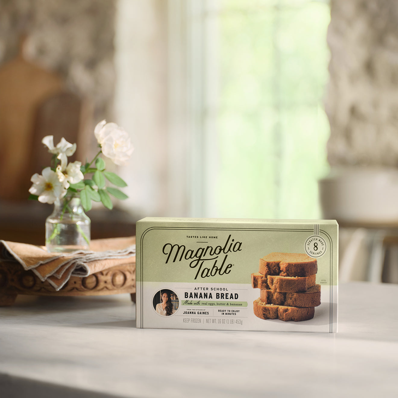 Box of Magnoliass Table Frozen After School Banana Bread on a table with a blurred background.
