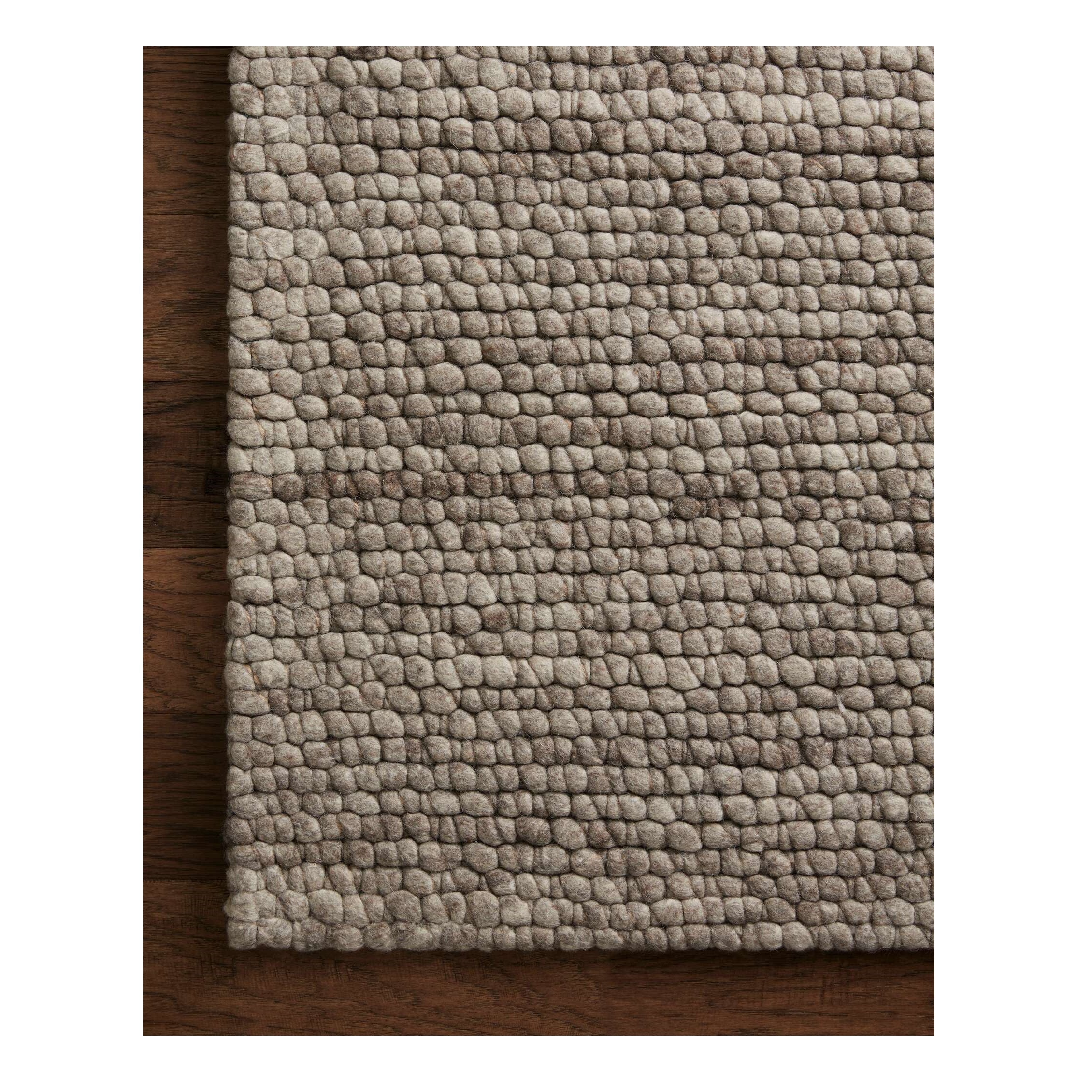 Caroline Granite Rug close up of corner on wood floor