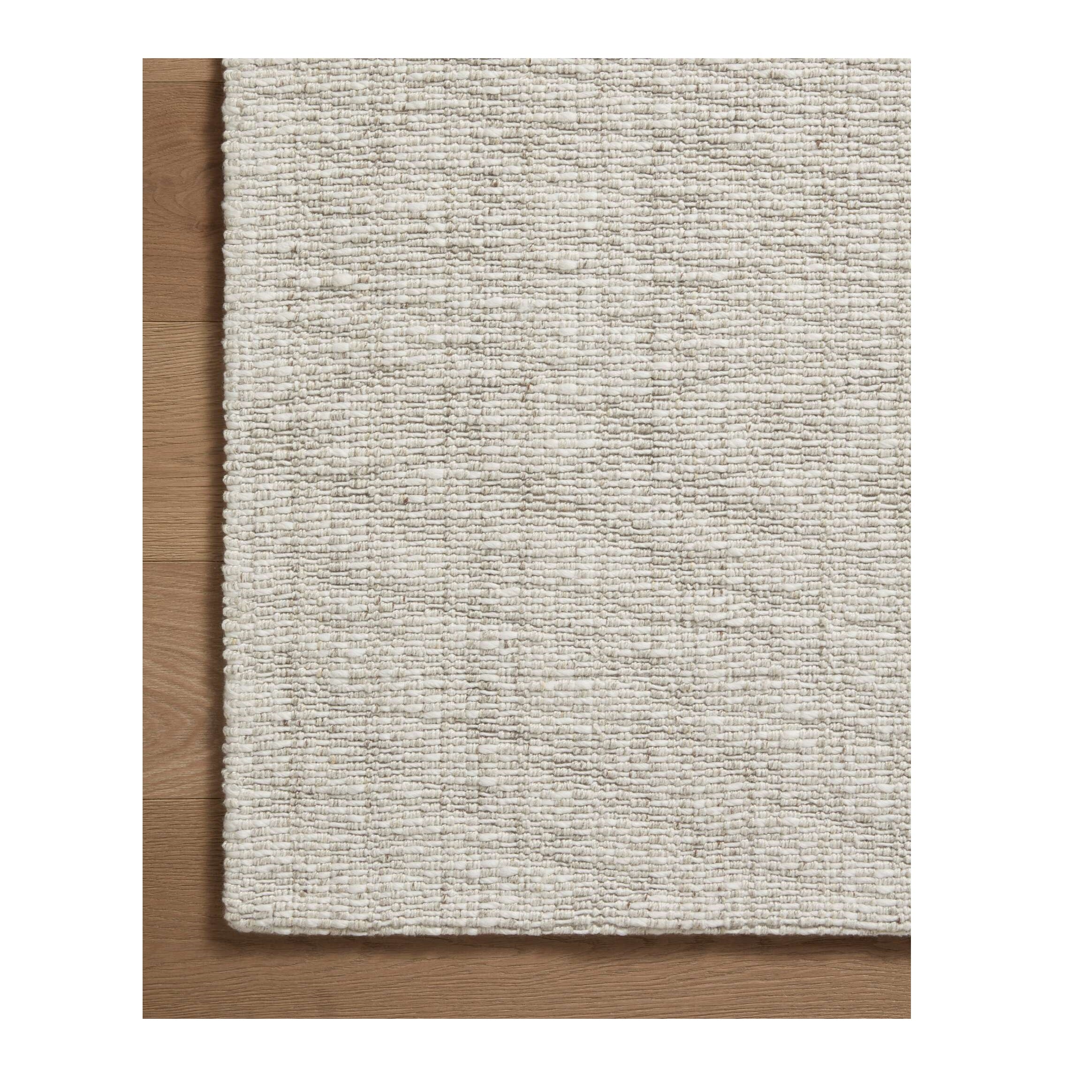Pippa Fog Rug close up of corner on wood floor