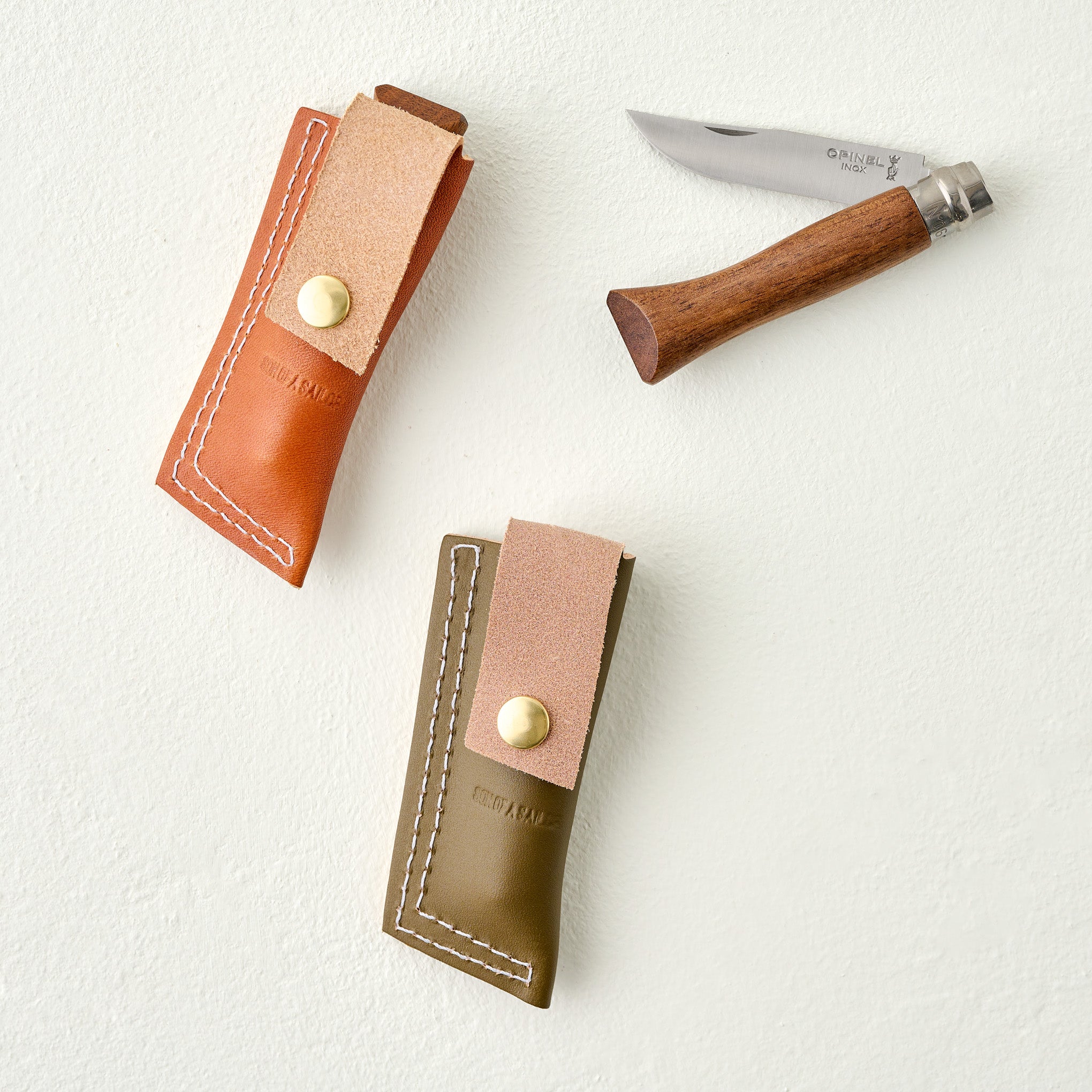Olive Whiskey Knife & Sheath Set shown with brown knife and sheath set
