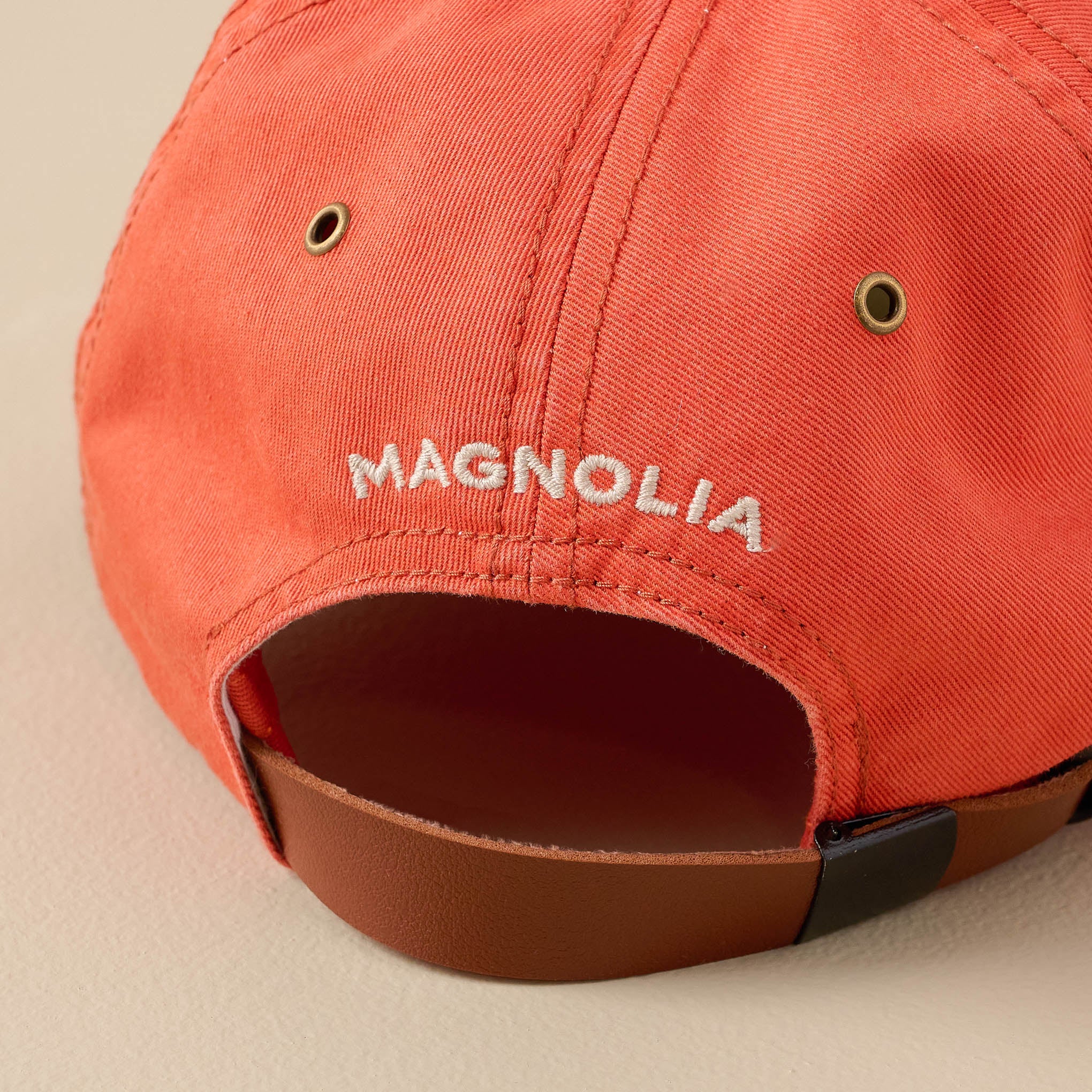 Silos Distressed Orange Baseball Hat back of hat showing adjustable leather strap