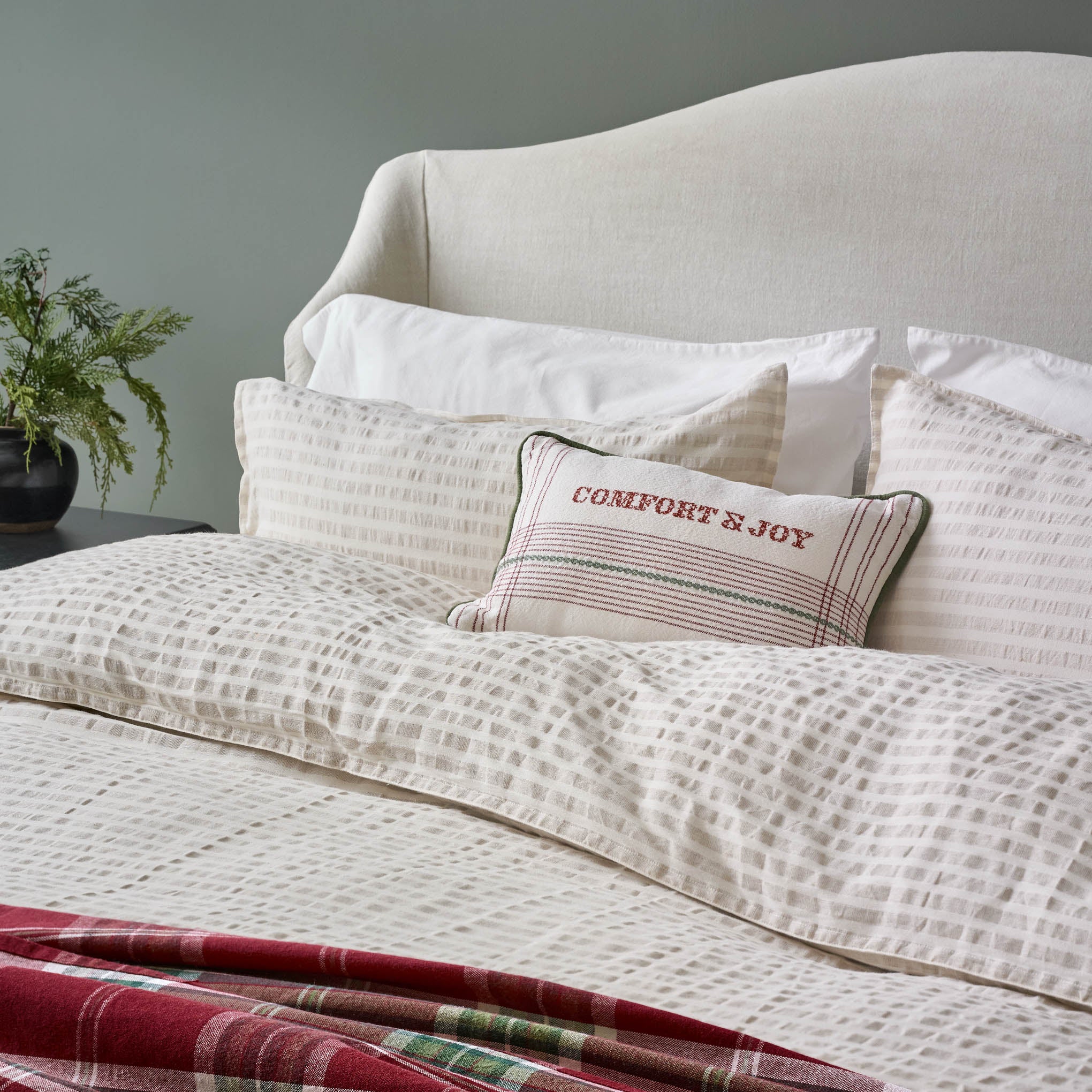 Antique White + Oatmeal Stripe Linen Cotton Duvet on a bed