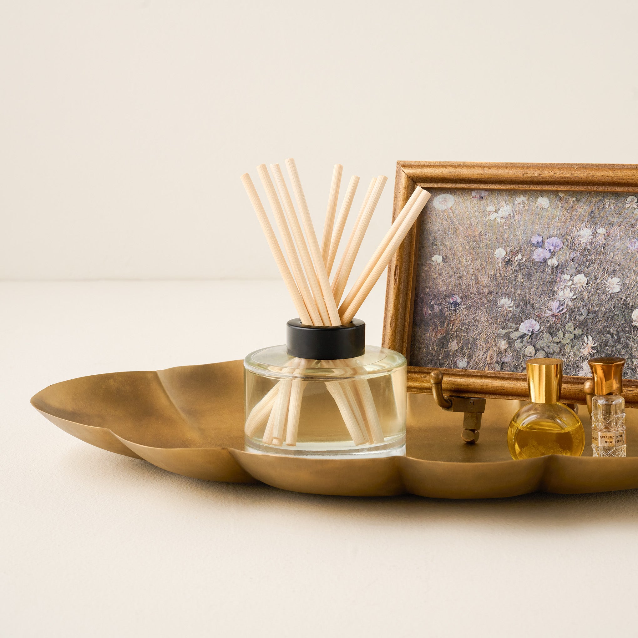 Twelve Nights Diffuser shown on tray with trinkets
