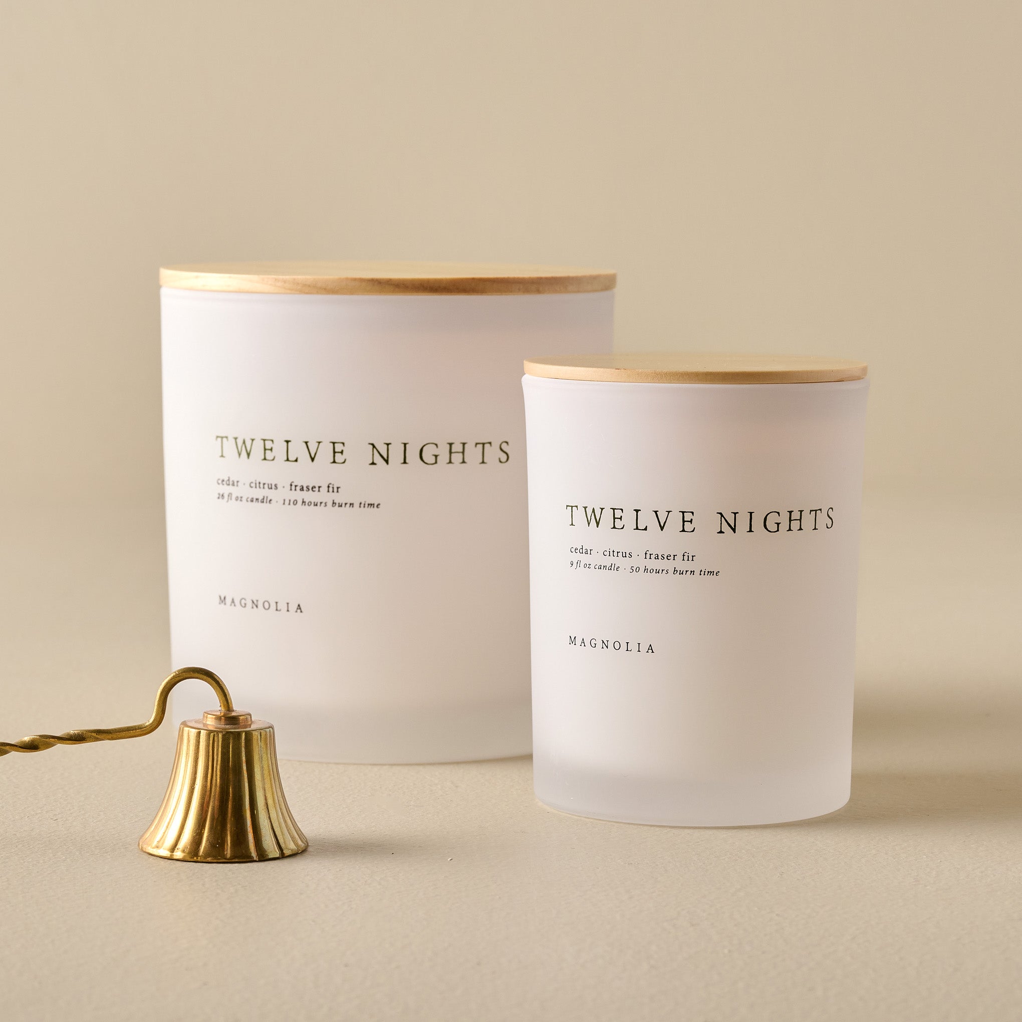 Magnoliass Twelve Nights Candles shown with candle snuffer