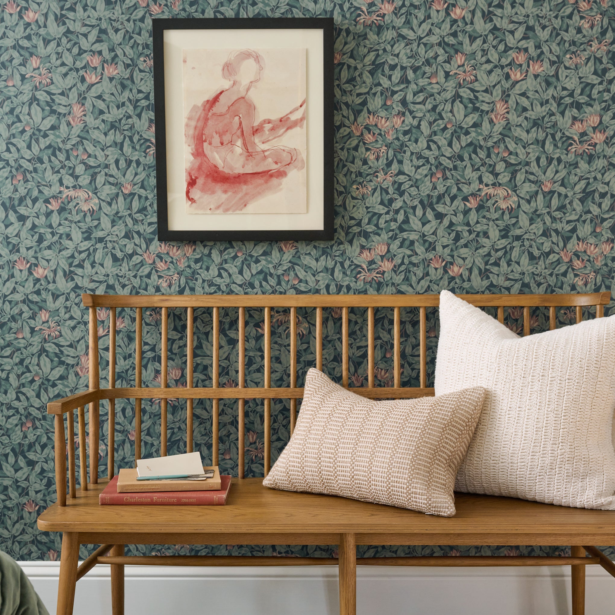 Sandy Bench against floral wallpaper