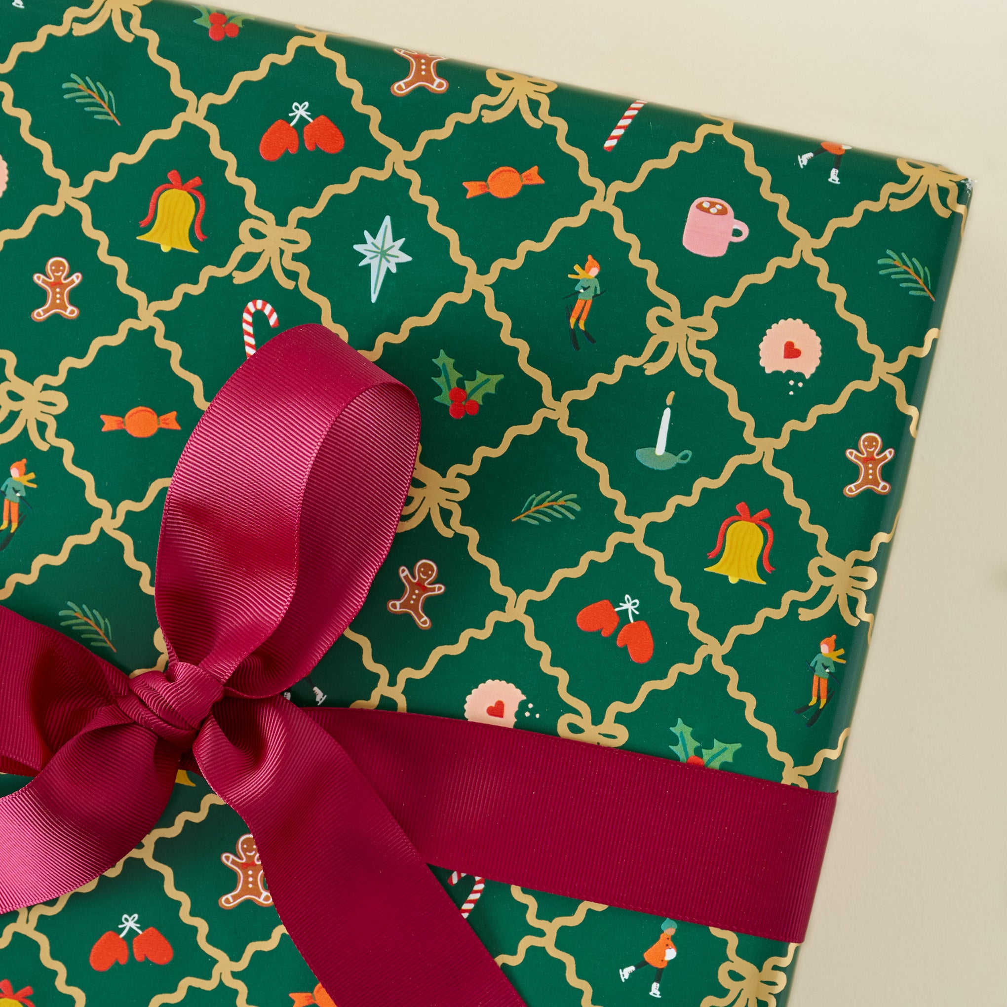 Holiday Argyle Continuous Wrapping Roll shown on gift with red ribbon